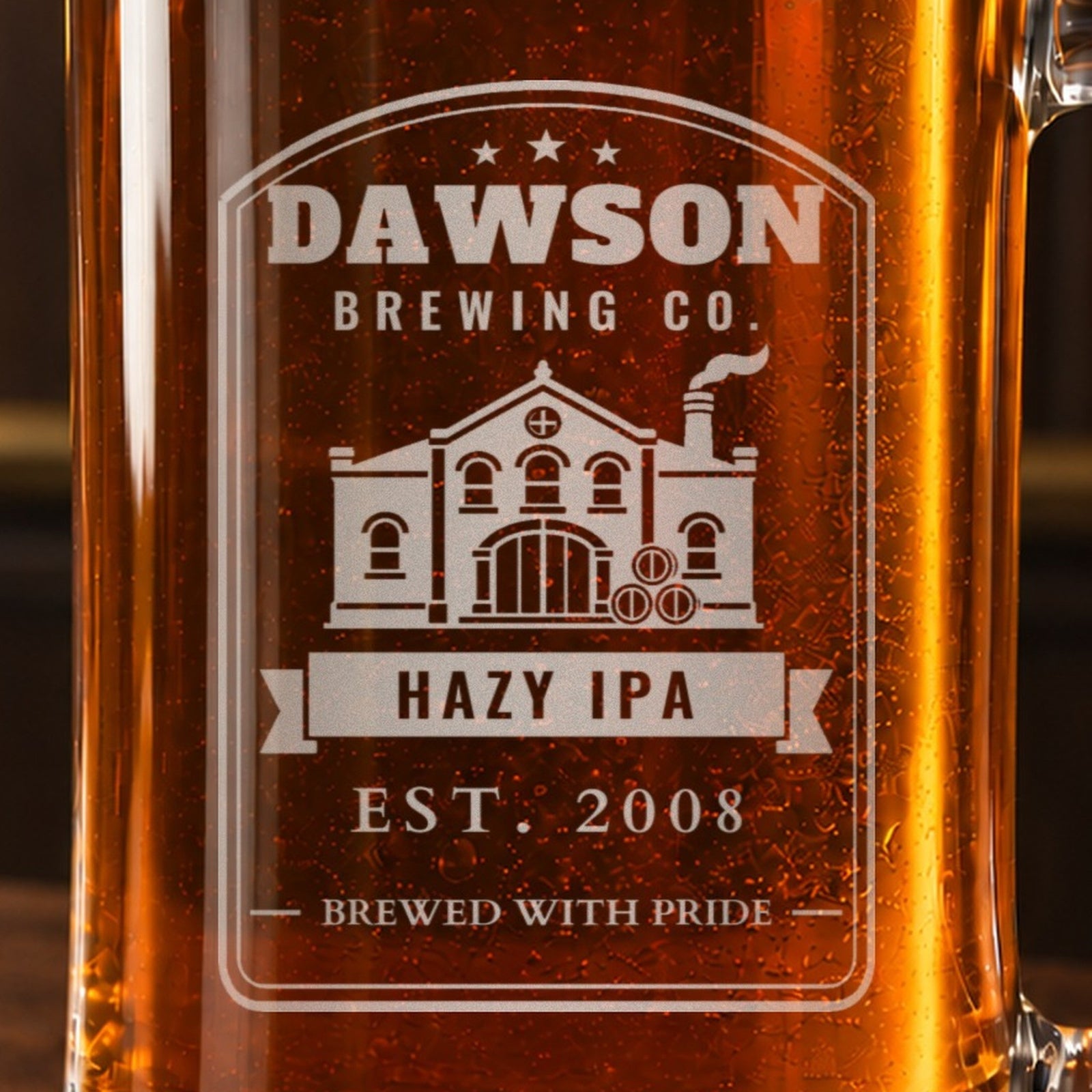 Close-up of the frosted vintage brewery label engraving with a brick brewhouse and barrels, reading DAWSON BREWING CO., HAZY IPA and EST. 2008