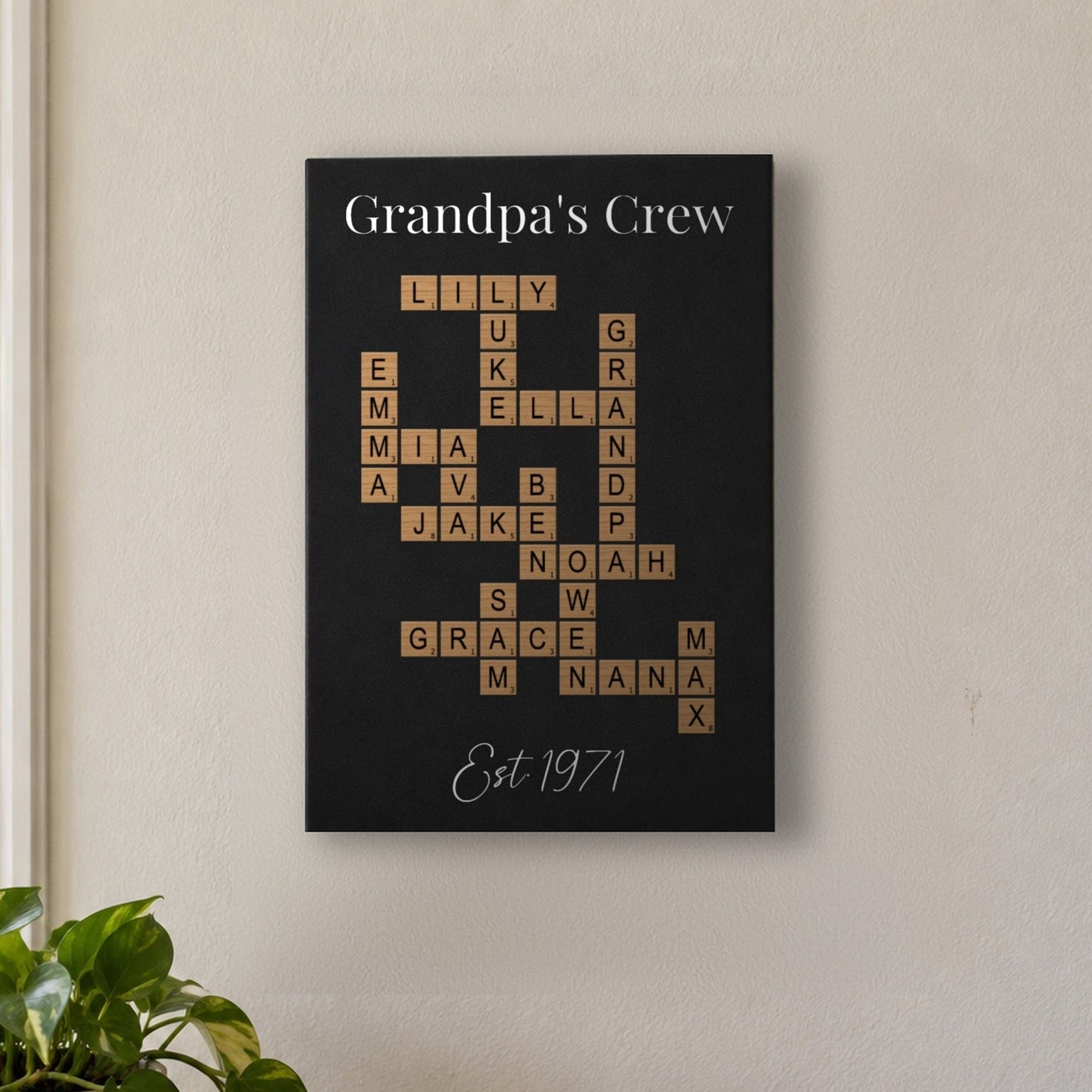 Crossword name wall decor in a front entryway, a Grandpa's Crew sign with 15 grandkids' names linked in one crossword puzzle above an oak console