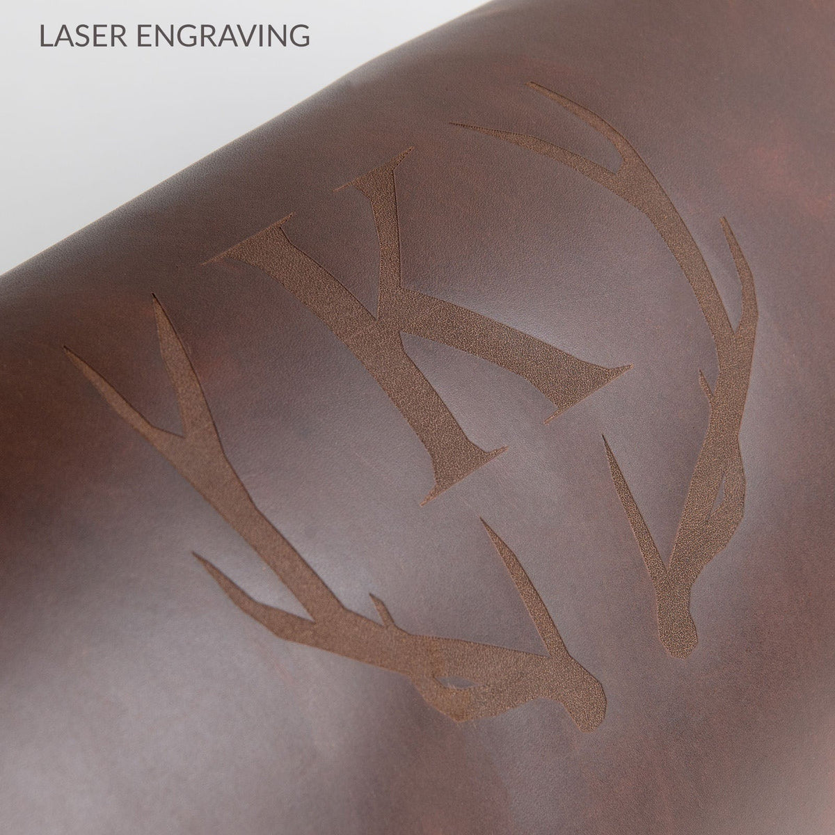 Full grain leather hanging wash bag with waterproof lining and multiple compartments for men.