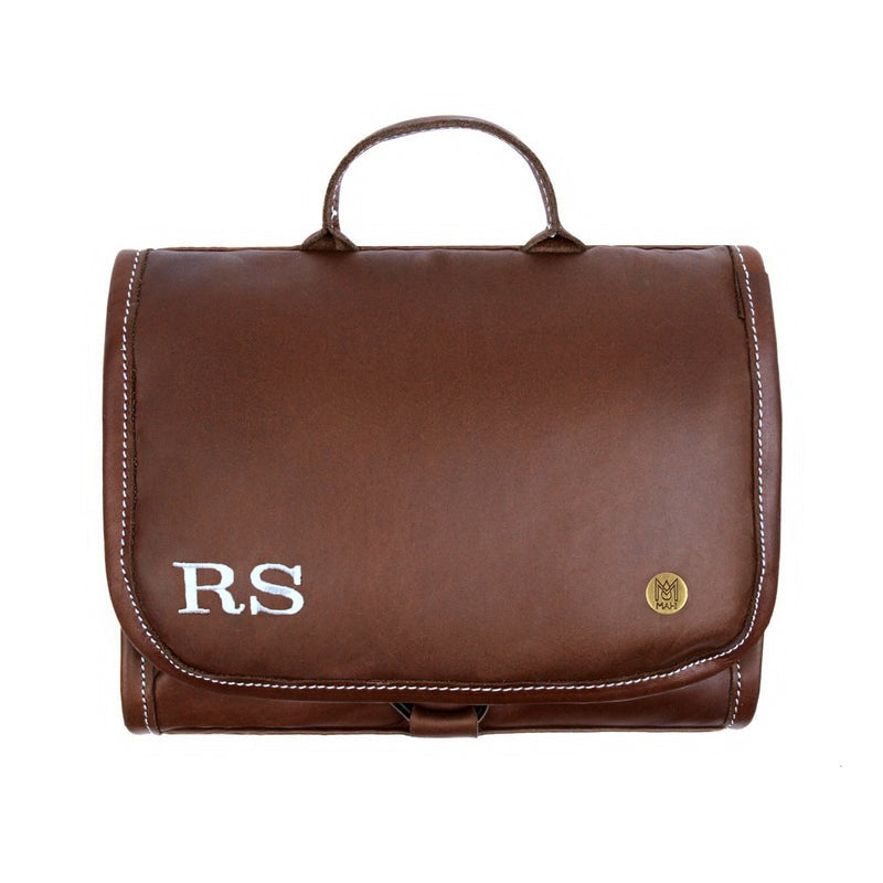 Full grain leather hanging wash bag with waterproof lining and multiple compartments for men.