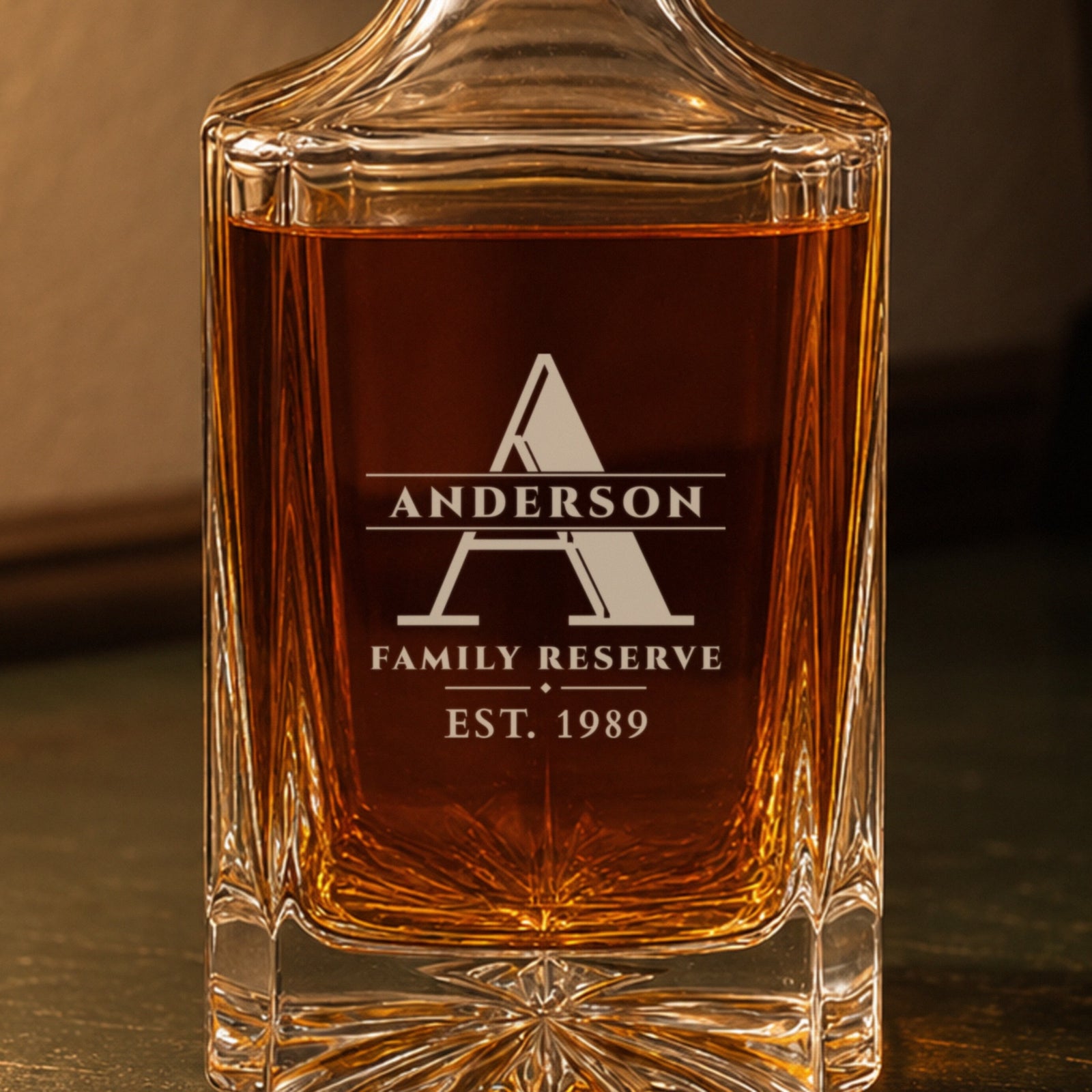 Close-up of the frosted engraving on the monogrammed decanter: a large A, Anderson, Family Reserve, est. 1989