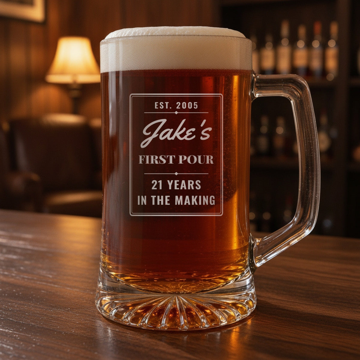 Personalized 21st birthday beer stein on a dark wood bar, engraved EST. 2005, Jake's in script, FIRST POUR and 21 YEARS IN THE MAKING