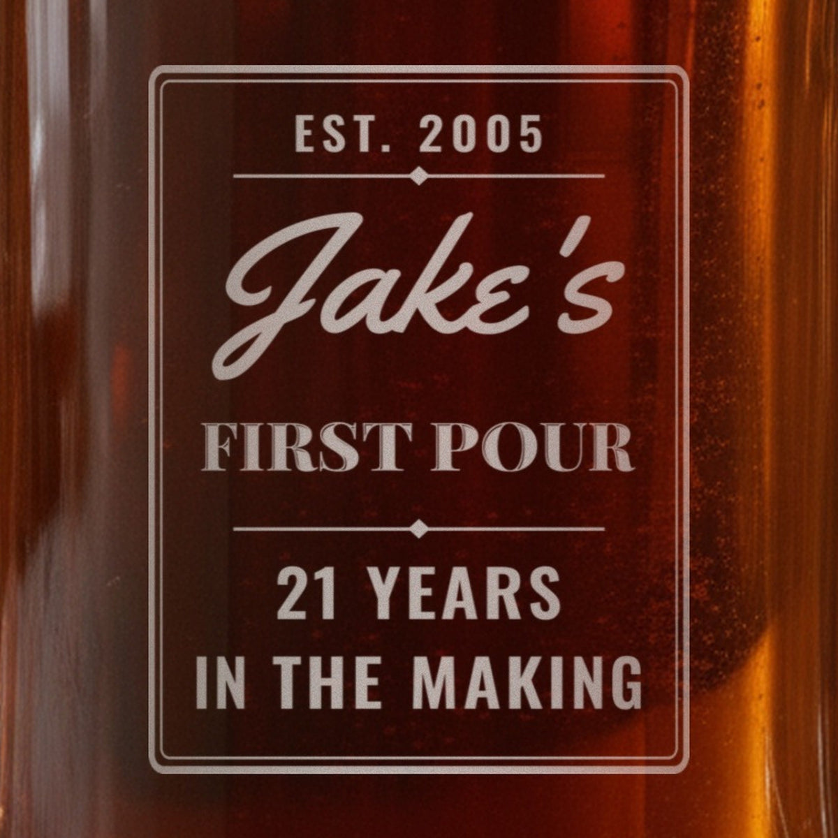 Close-up of the frosted laser engraving on the 21st birthday beer stein: EST. 2005, Jake's in script, FIRST POUR and 21 YEARS IN THE MAKING