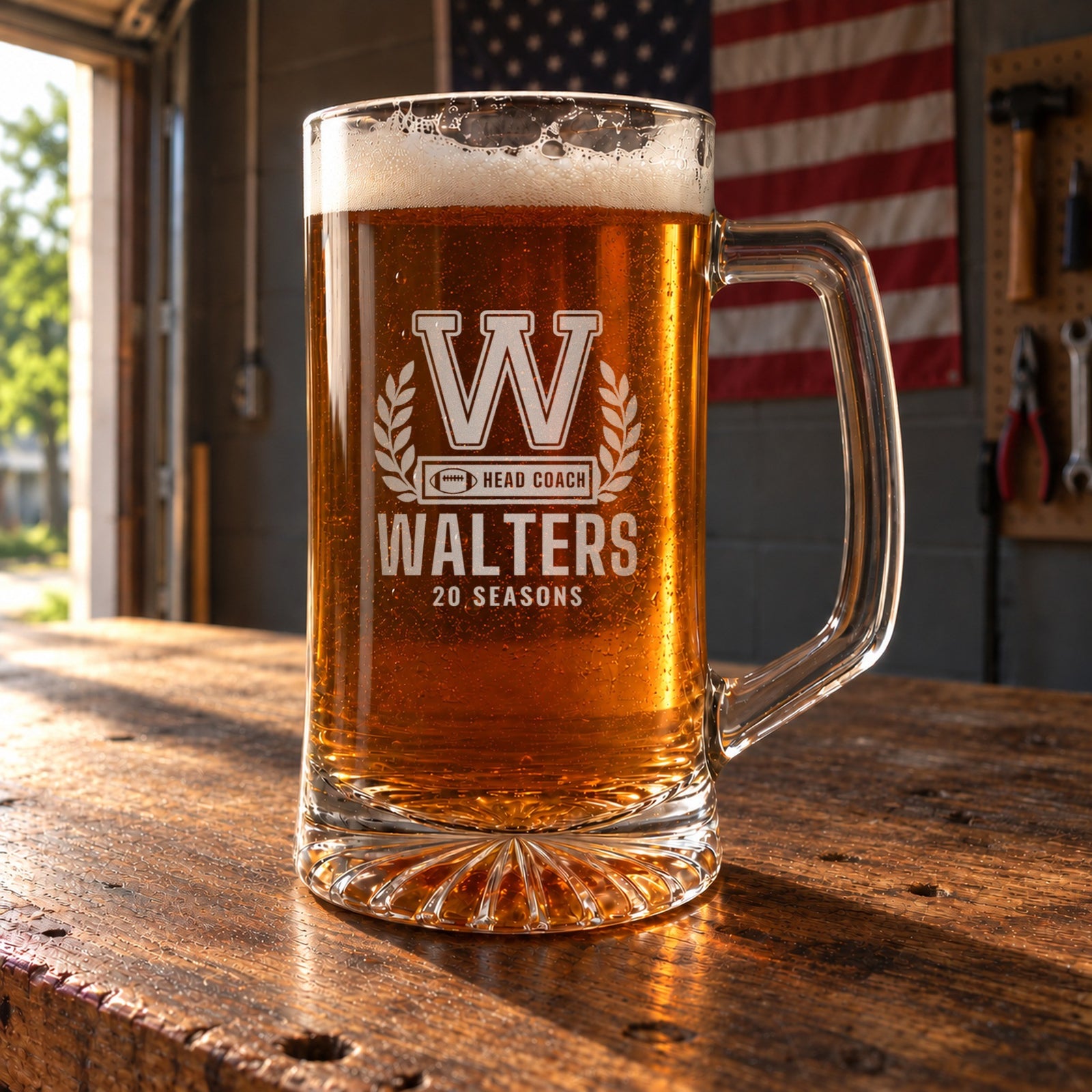 Personalized football coach letterman beer stein in a real setting, engraved with a varsity letter with laurel and a COACH bar: W, Head Coach, Walters, 20 Seasons