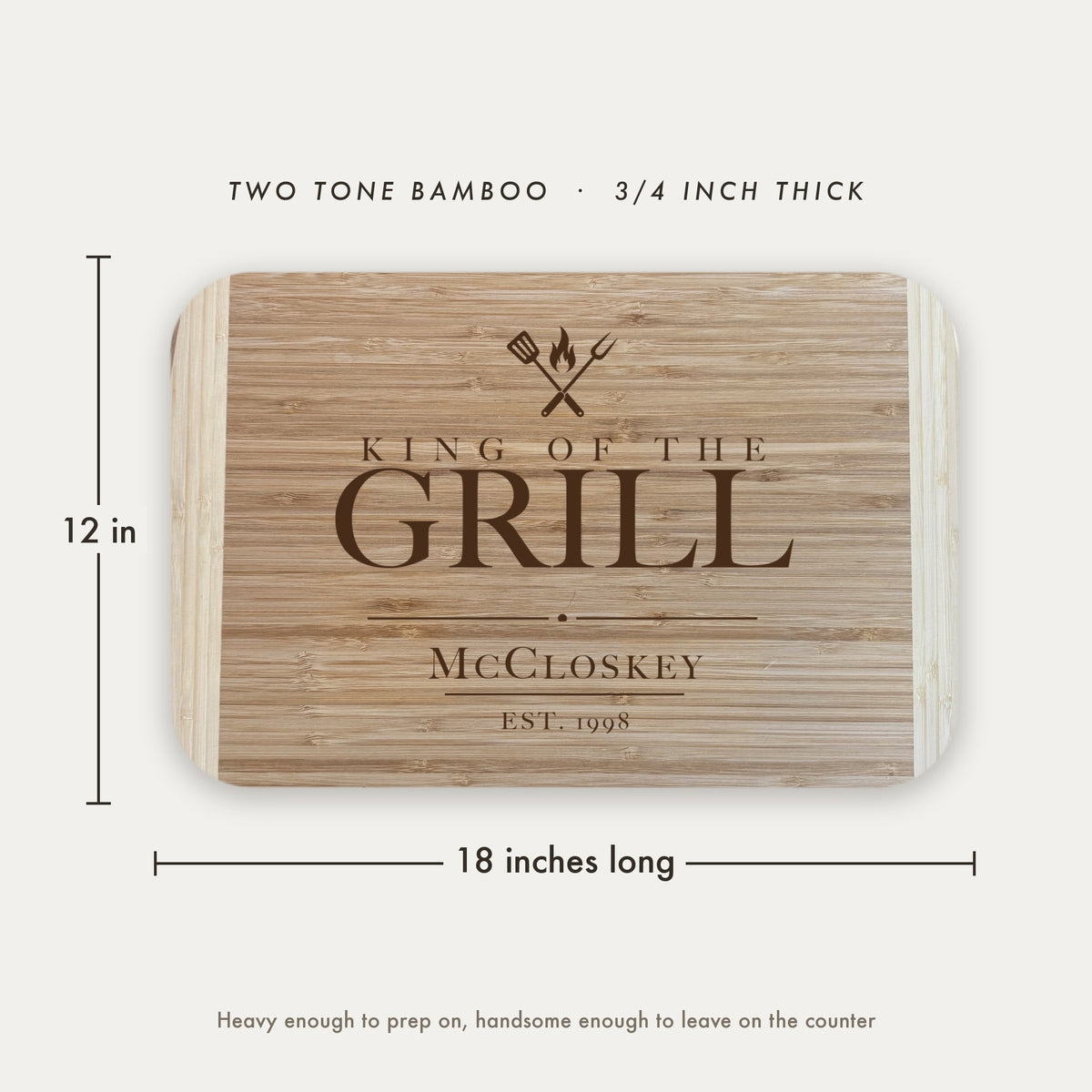 Dimension diagram of the King of the Grill cutting board showing 18 inches long by 12 inches wide, in two tone bamboo at three quarters of an inch thick.