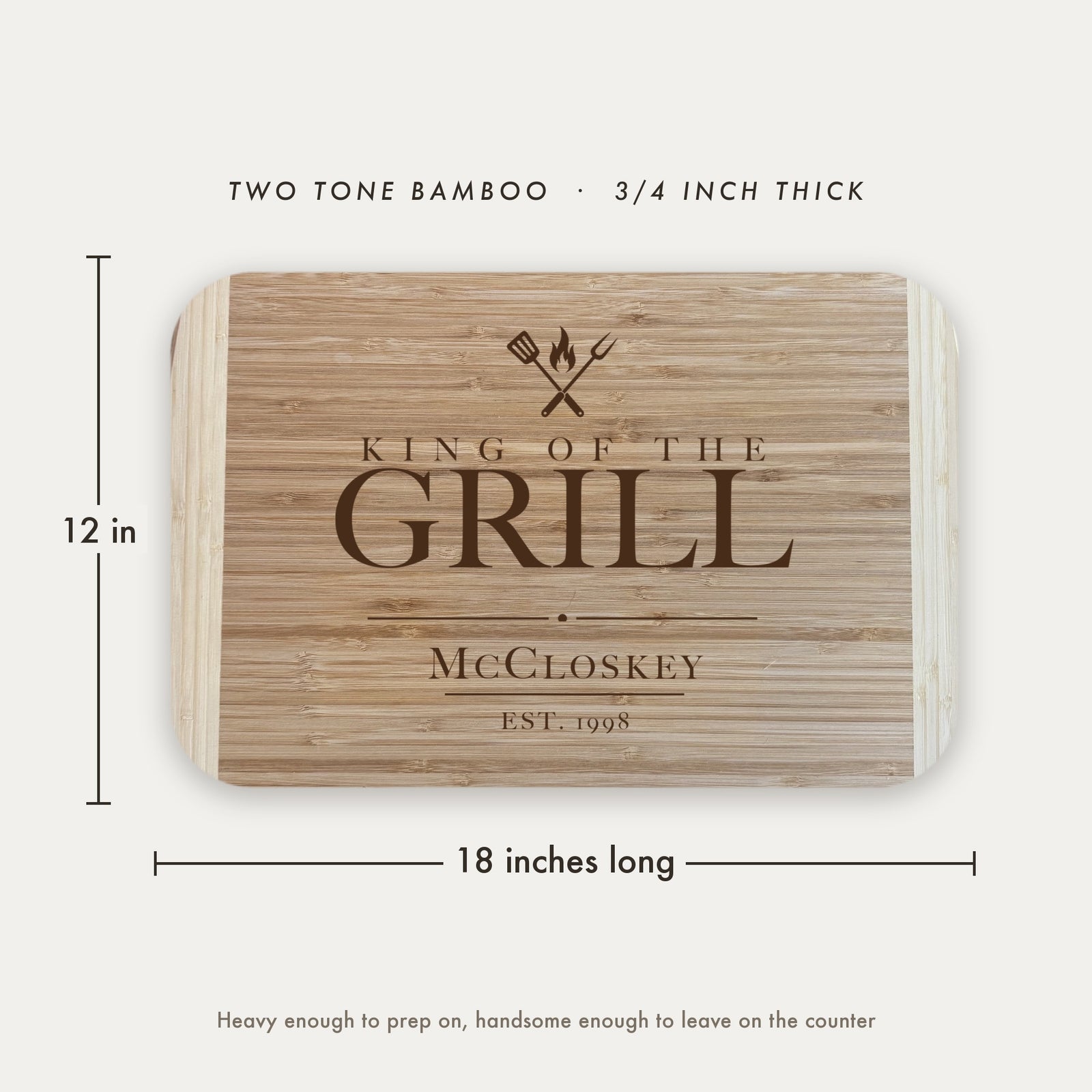 Dimension diagram of the King of the Grill cutting board showing 18 inches long by 12 inches wide, in two tone bamboo at three quarters of an inch thick.