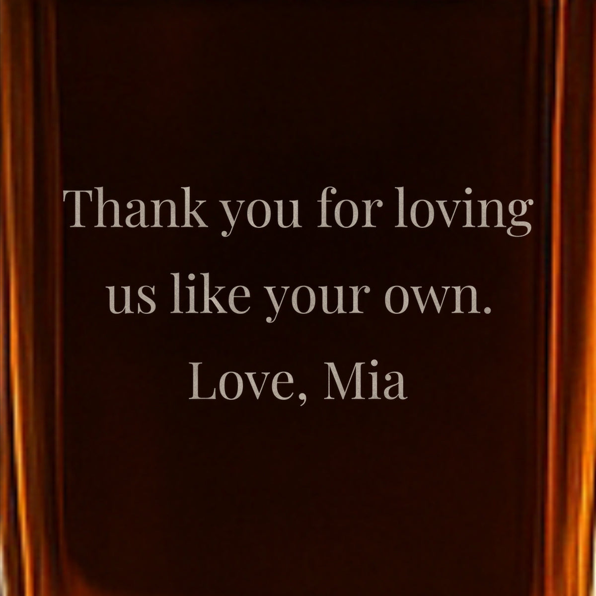 Close-up of a back note on a gift for stepdad from his kids, frosted into the glass: Thank you for loving us like your own. Love, Mia