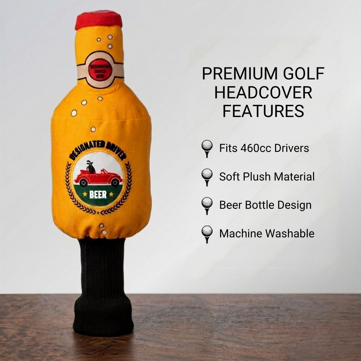 Yellow golf headcover with beer bottle design on a wooden surface