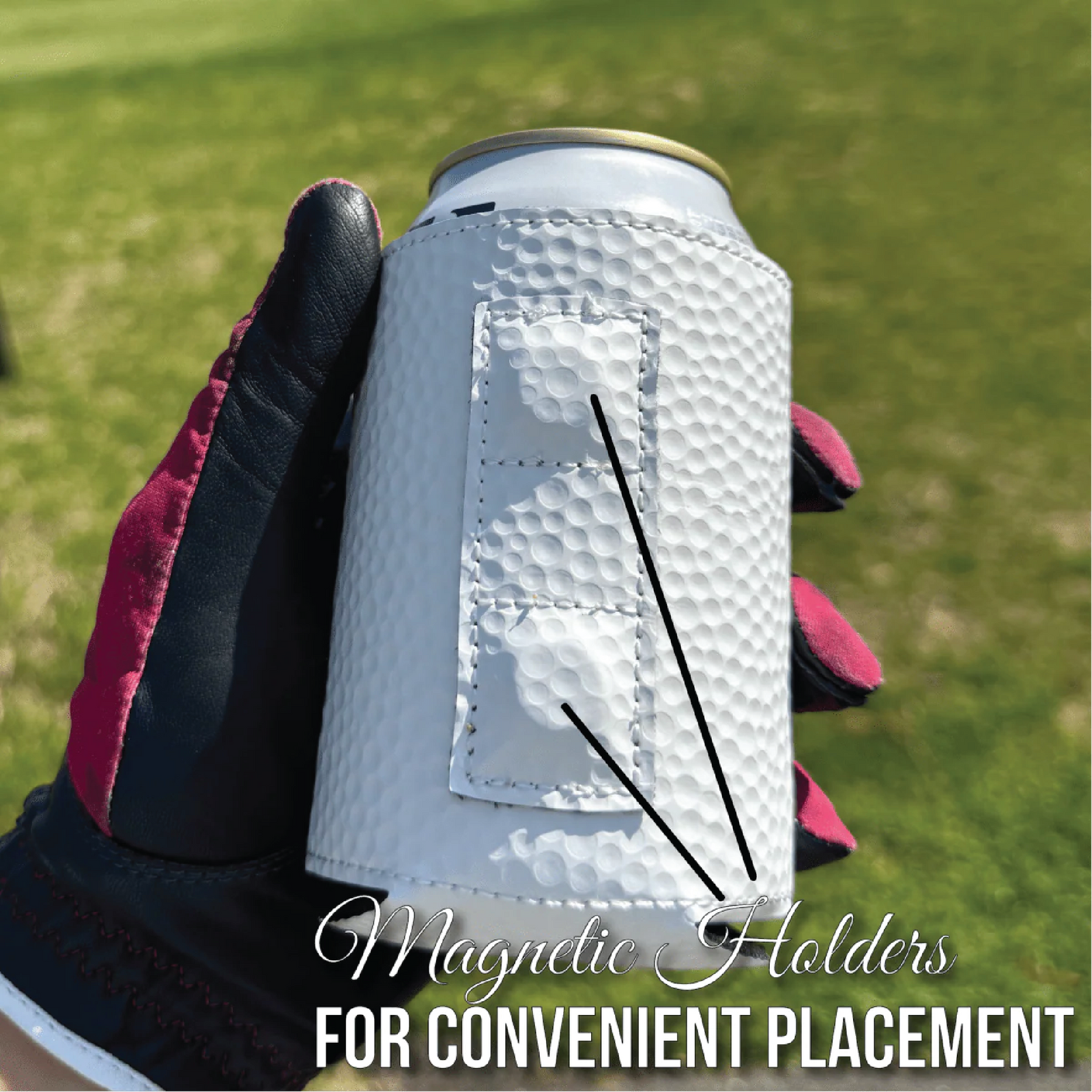 White golf ball-textured can cooler with magnetic backing held in gloved hand against golf course background, showing customization area with sample engraving