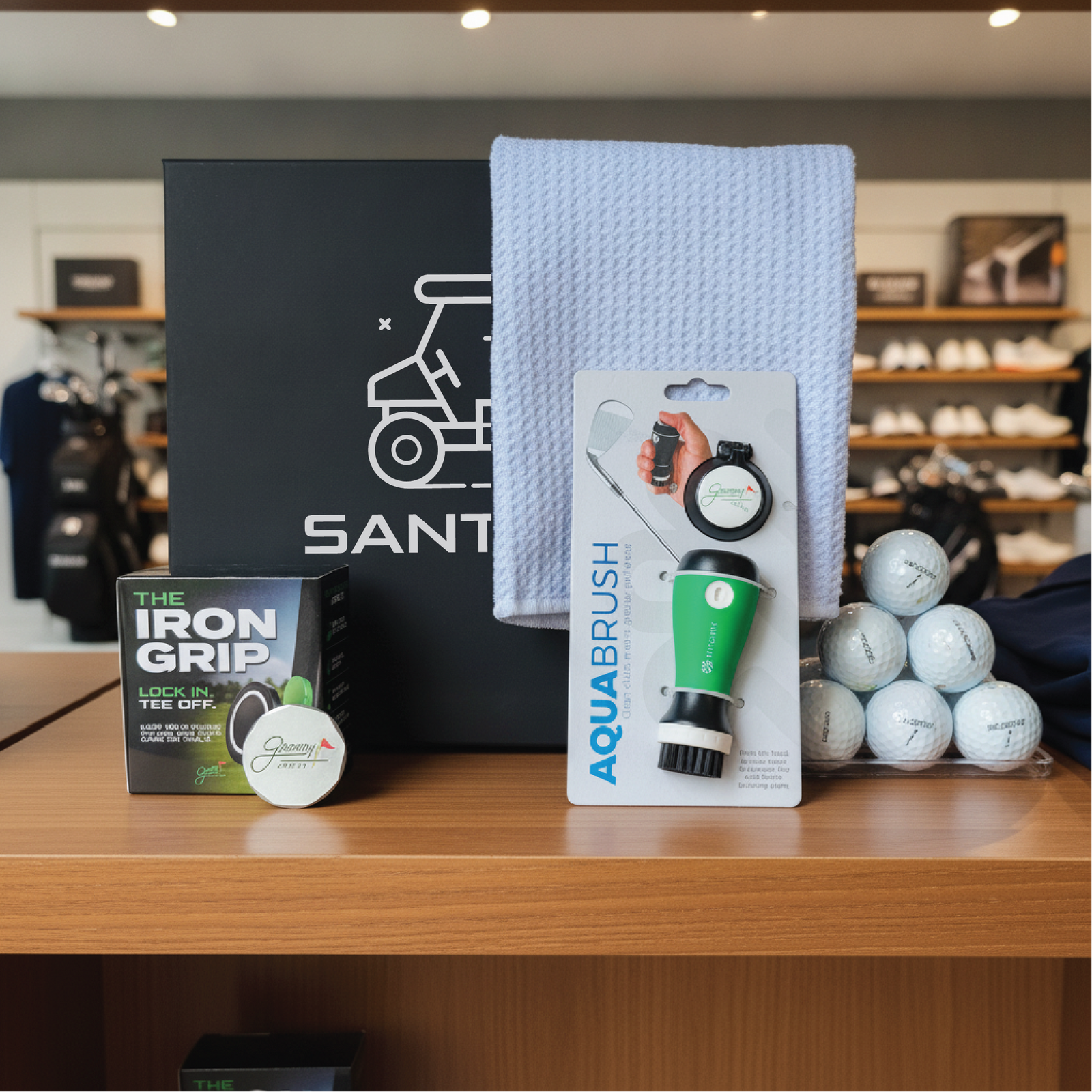 Personalized golf gift set for men, a keepsake box engraved with a name and filled with on-course golf accessories.