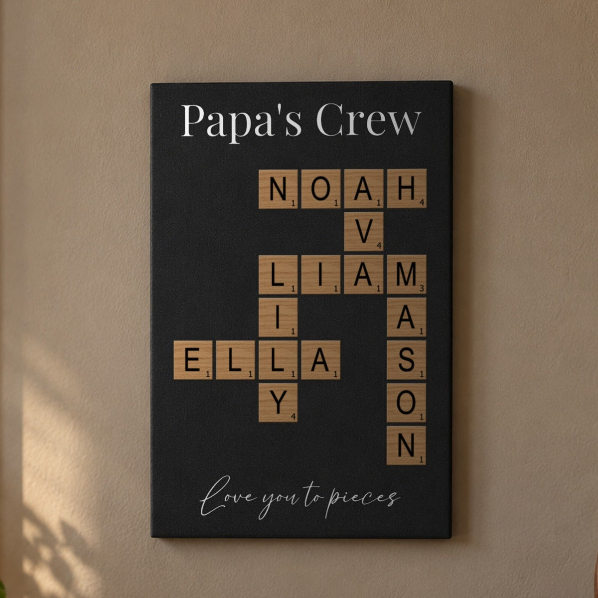 Grandkids crossword sign for Grandpa hanging in a den, Papa's Crew title over wood-tone tiles spelling Liam, Ava, Noah, Ella, Mason and Lily