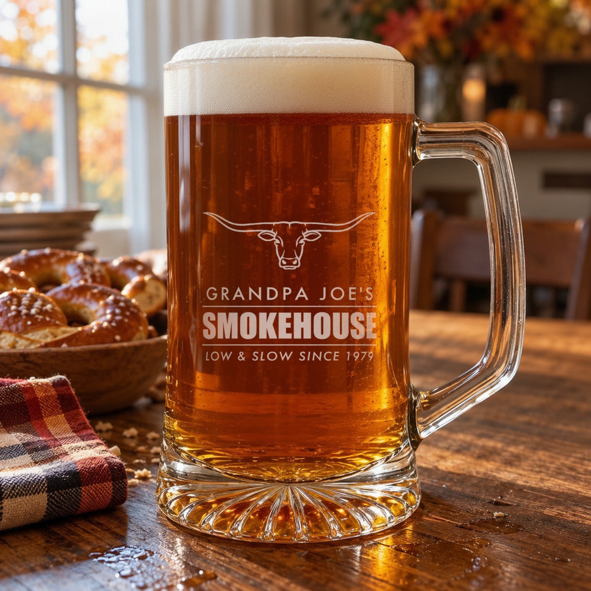 Engraved beer stein on an autumn table, personalized with a longhorn and Grandpa Joe's Smokehouse, Low and Slow Since 1979
