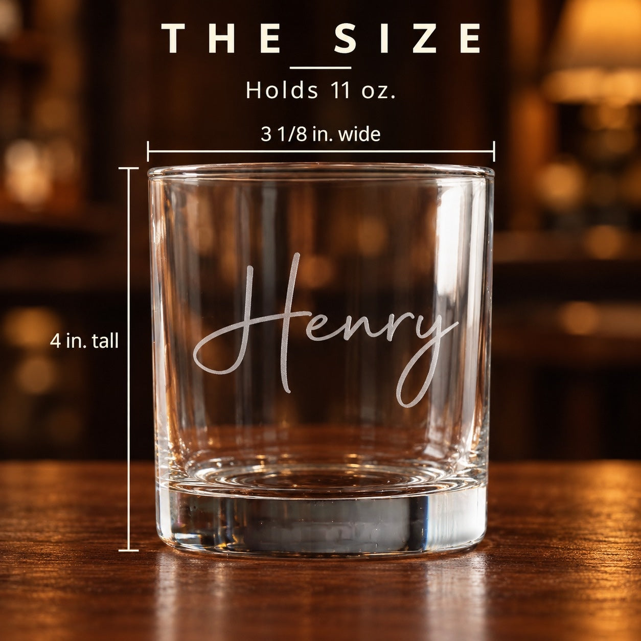Size of the personalized whiskey glass: 4 inches tall and 3 1/8 inches wide, holds 11 oz, engraved with the name Henry in flowing script