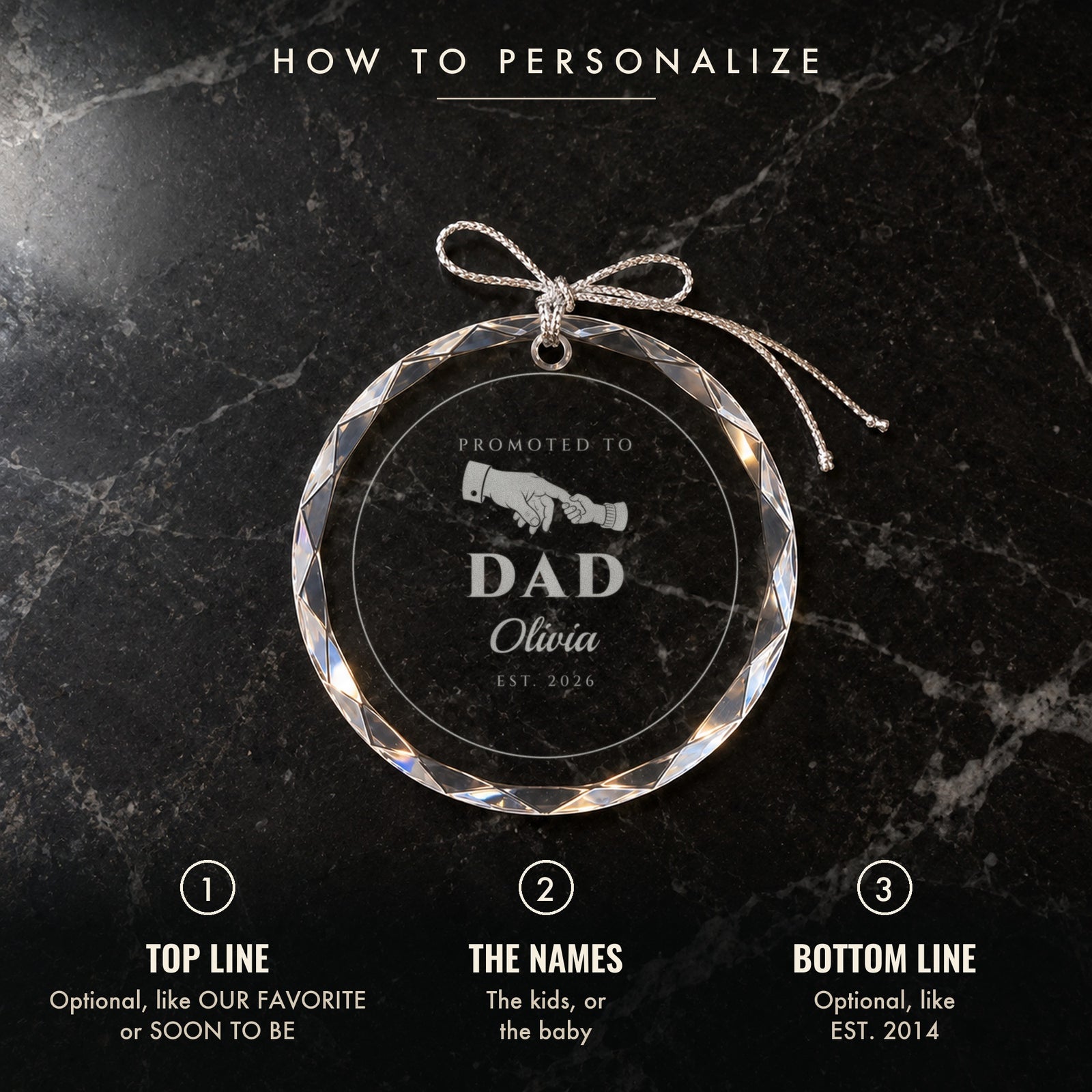 How to personalize the dad ornament: 1 optional top line, 2 the names, 3 optional bottom line, shown on black marble engraved PROMOTED TO DAD