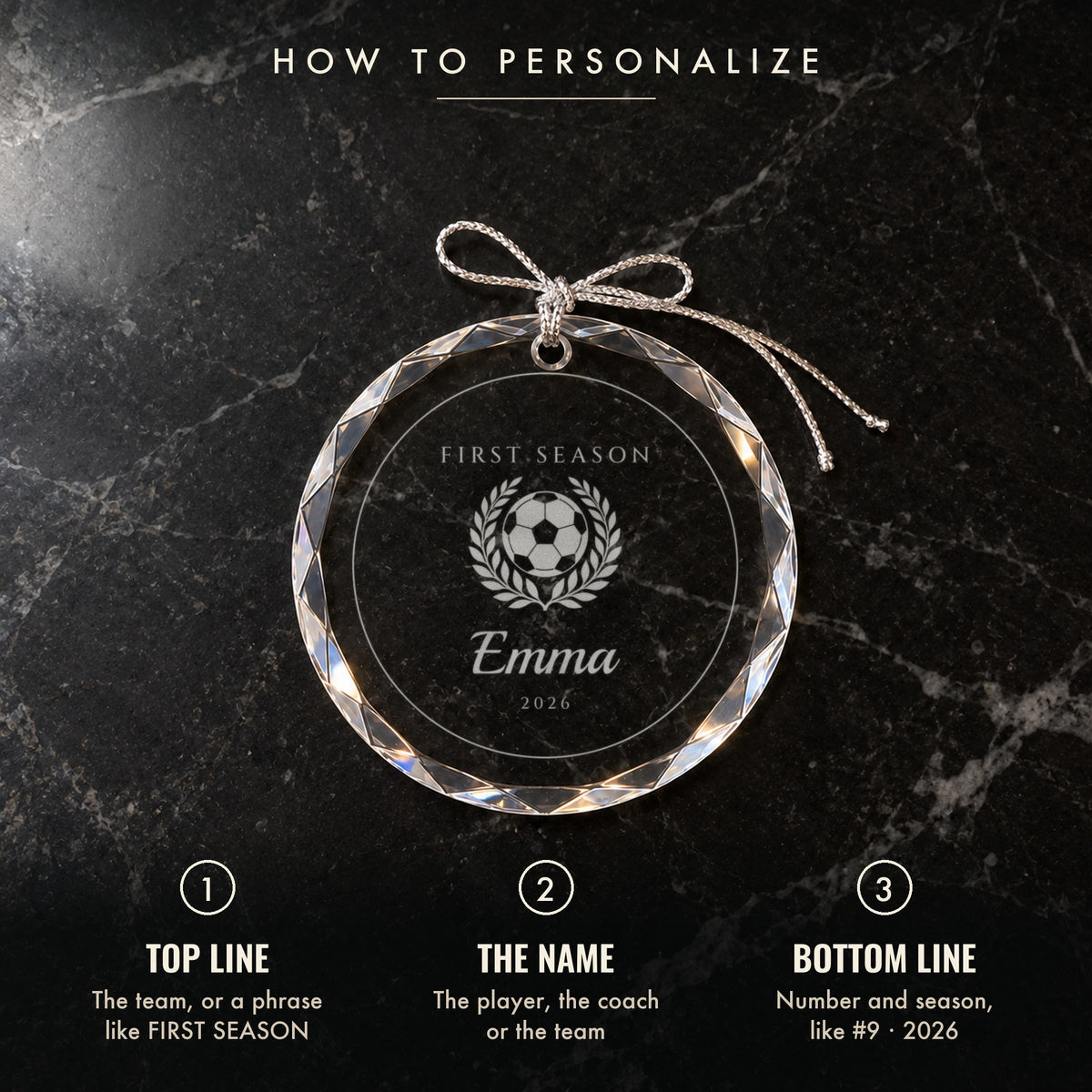 How to personalize the soccer Christmas ornament: 1 top line, 2 the name, 3 number and season, shown on black marble engraved FIRST SEASON, Emma