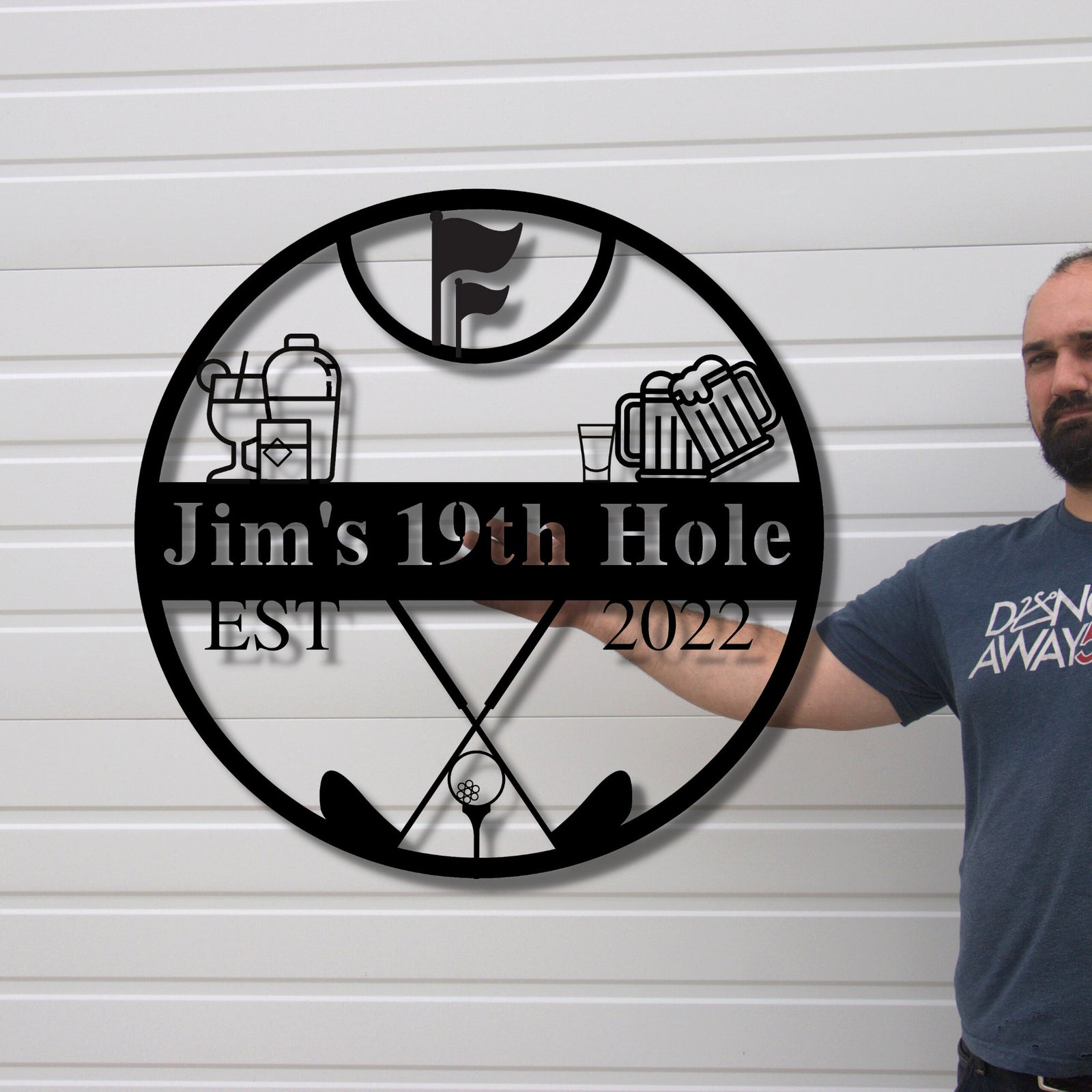 Man holding the personalized 19th hole golf pub sign, showing the large scale of the custom metal bar sign