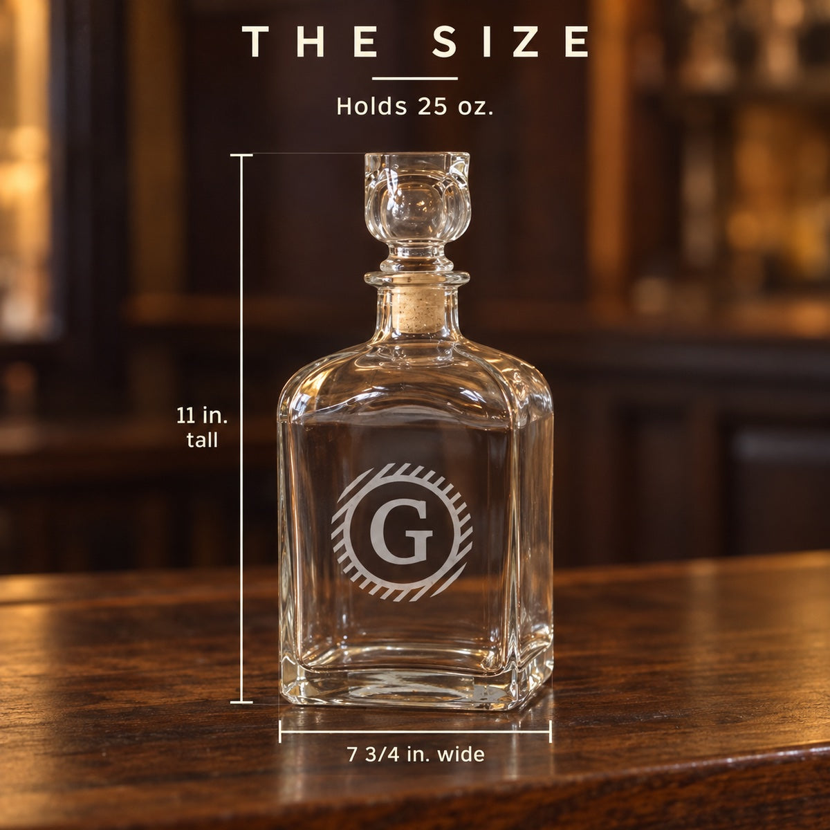 Size of the initial whiskey decanter etched G: 7 3/4 inches wide and 11 inches tall to the top of the stopper, holds 25 ounces