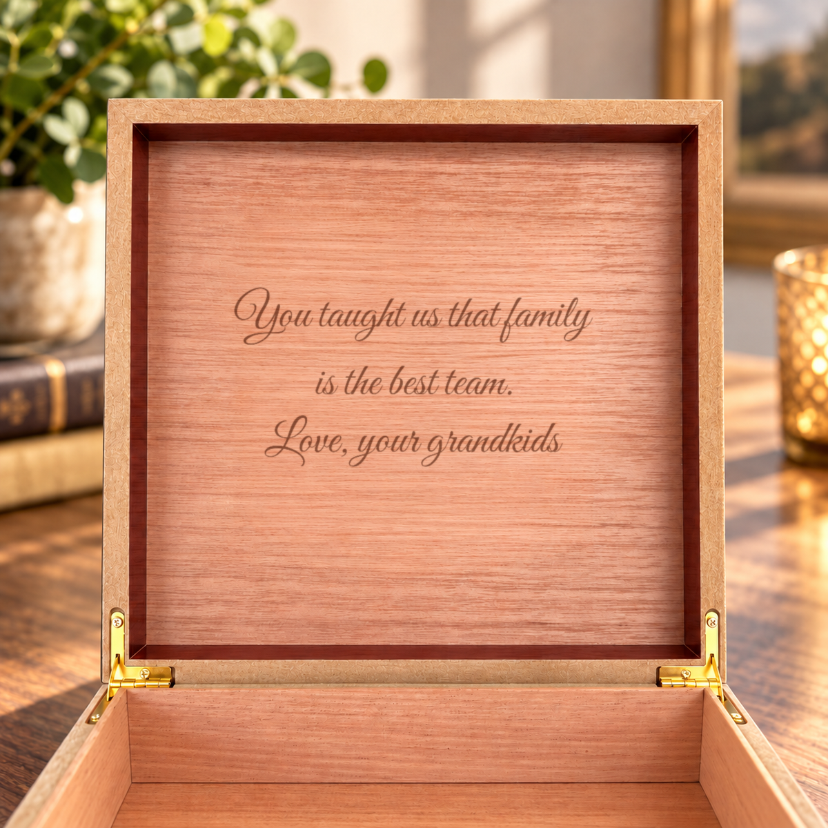 Inside of the grandpa keepsake box lid, light cedar engraved in script with You taught us that family is the best team. Love, your grandkids