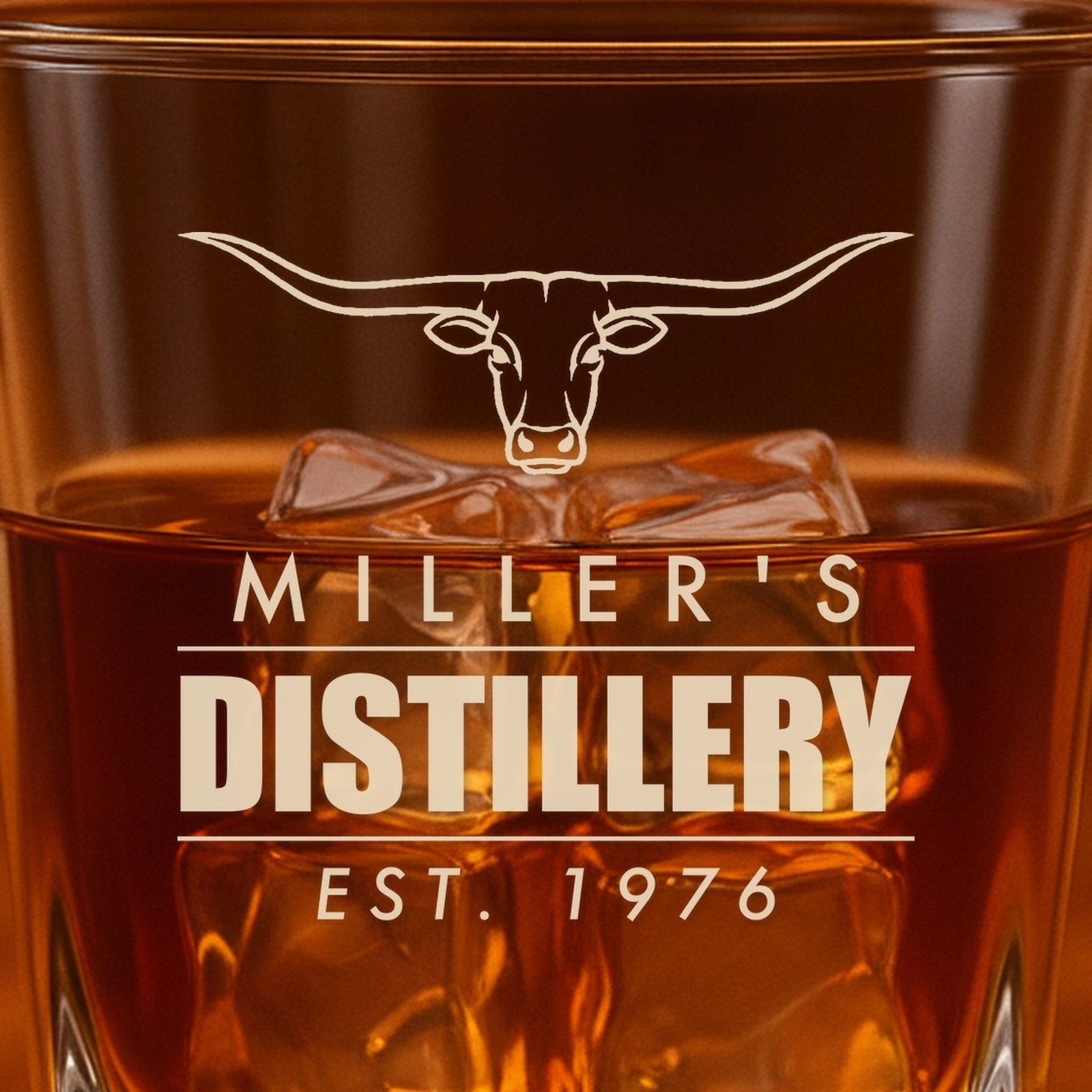 Close-up of the frosted laser engraving on the rocks glass: a longhorn steer over Miller's, a bold Distillery and Est. 1976