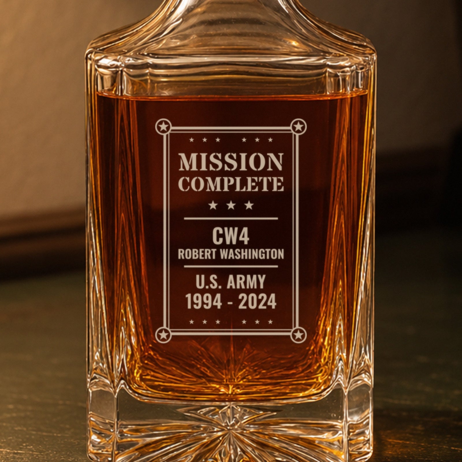 Close-up of the frosted engraving: Mission Complete, CW4 Robert Washington, U.S. Army, 1994 to 2024, inside a star-cornered frame