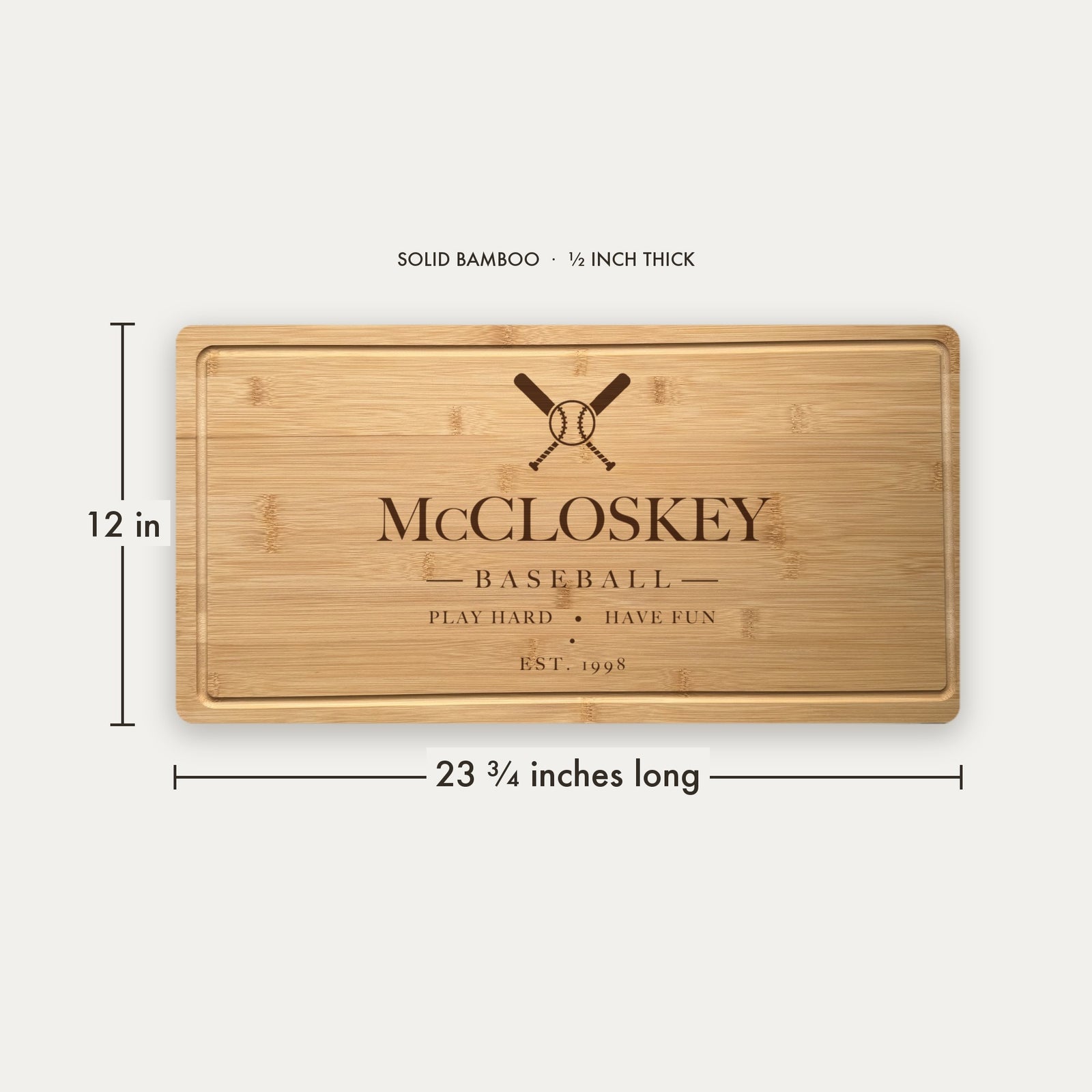 Size guide for the personalized baseball cutting board, 23 and three quarter inches long by 12 inches wide in half inch thick solid bamboo.