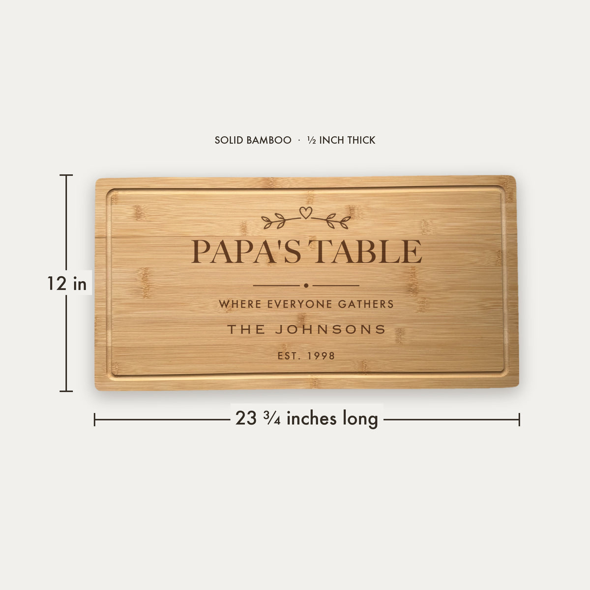 Size guide for the personalized grandpa cutting board, 23 and three quarter inches long by 12 inches wide in half inch thick solid bamboo.