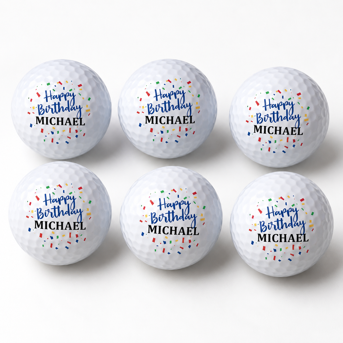 Personalized happy birthday golf balls, a set of six printed with Happy Birthday in colorful confetti and the name Michael