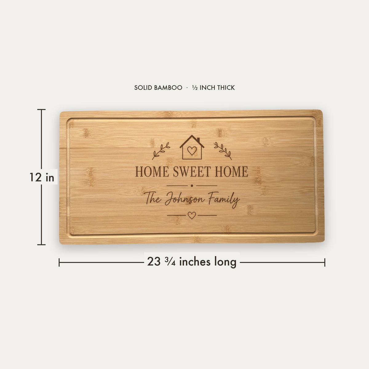 Size guide for the personalized housewarming cutting board, 23 and three quarter inches long by 12 inches wide in half inch thick solid bamboo.