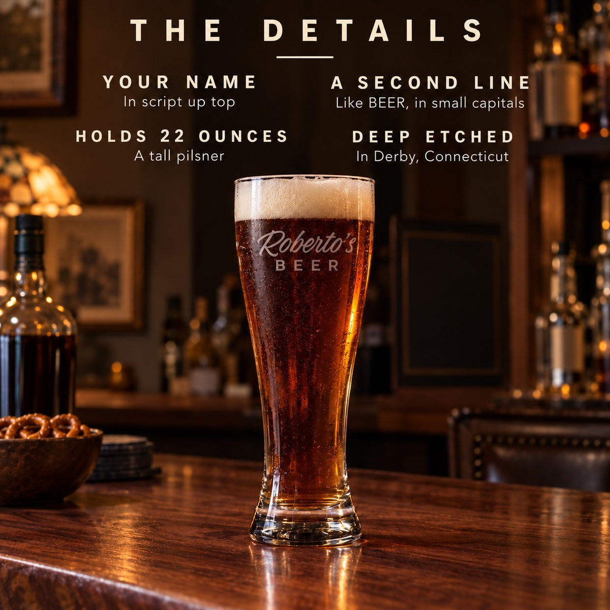 Details of the personalized pilsner glass etched Roberto's BEER: your name in script, a second line, holds 22 ounces, etched in Derby, Connecticut