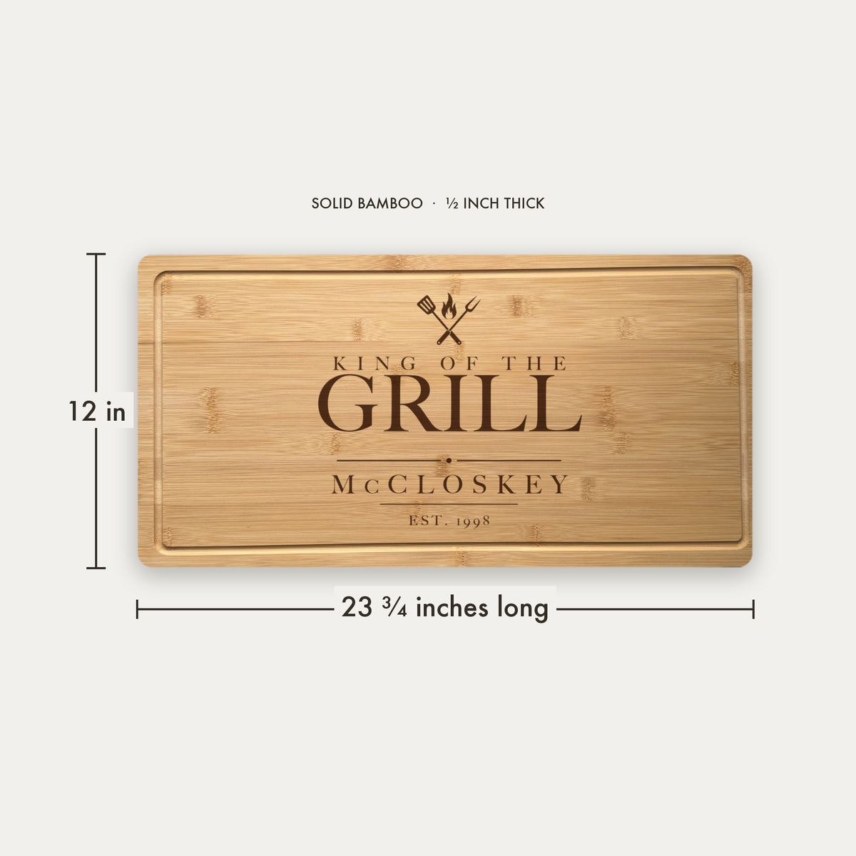 Size guide for the personalized engraved steak board, 23 and three quarter inches long by 12 inches wide in half inch thick solid bamboo.