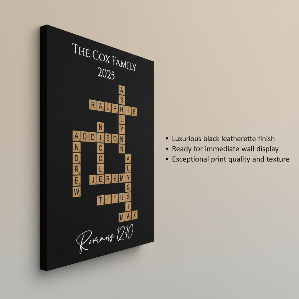 Black canvas wall sign with sample family names arranged in crossword-puzzle style, reading "The Cox Family 2025" at top and "Romans 12:10" at bottom