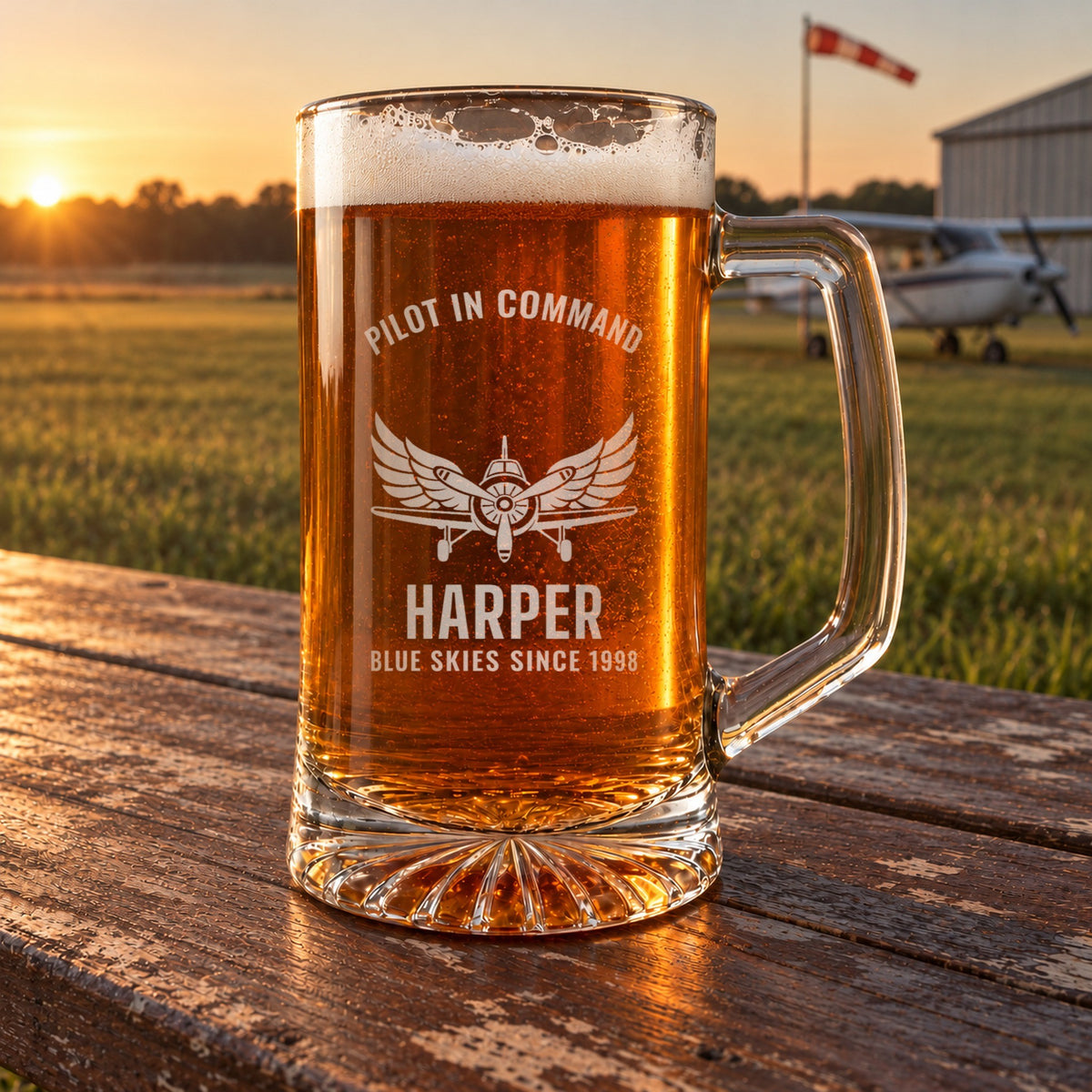 Personalized pilot beer stein in a real setting, engraved with a vintage propeller airplane and spread wings: Pilot in Command, Harper, Blue Skies Since 1998