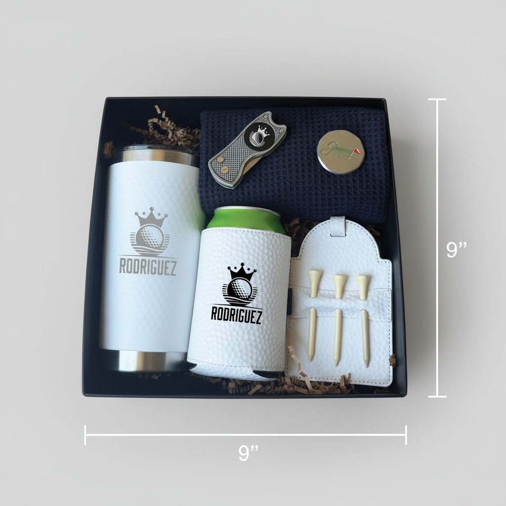 Golf gift set in black box containing white insulated tumbler and can cooler laser-engraved with sample name "RODRIGUEZ" and crown logo, plus divot tool, ball marker, tee holder with wooden tees, and microfiber towel