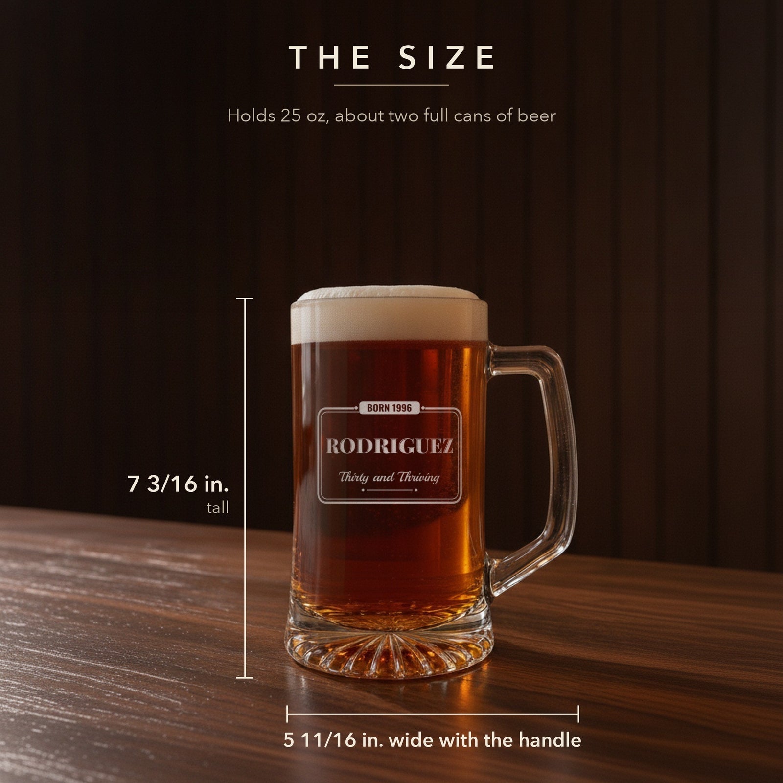 Size guide for the 25 oz personalized birthday beer stein, 7 3/16 inches tall and 5 11/16 inches wide with the handle, engraved for Rodriguez