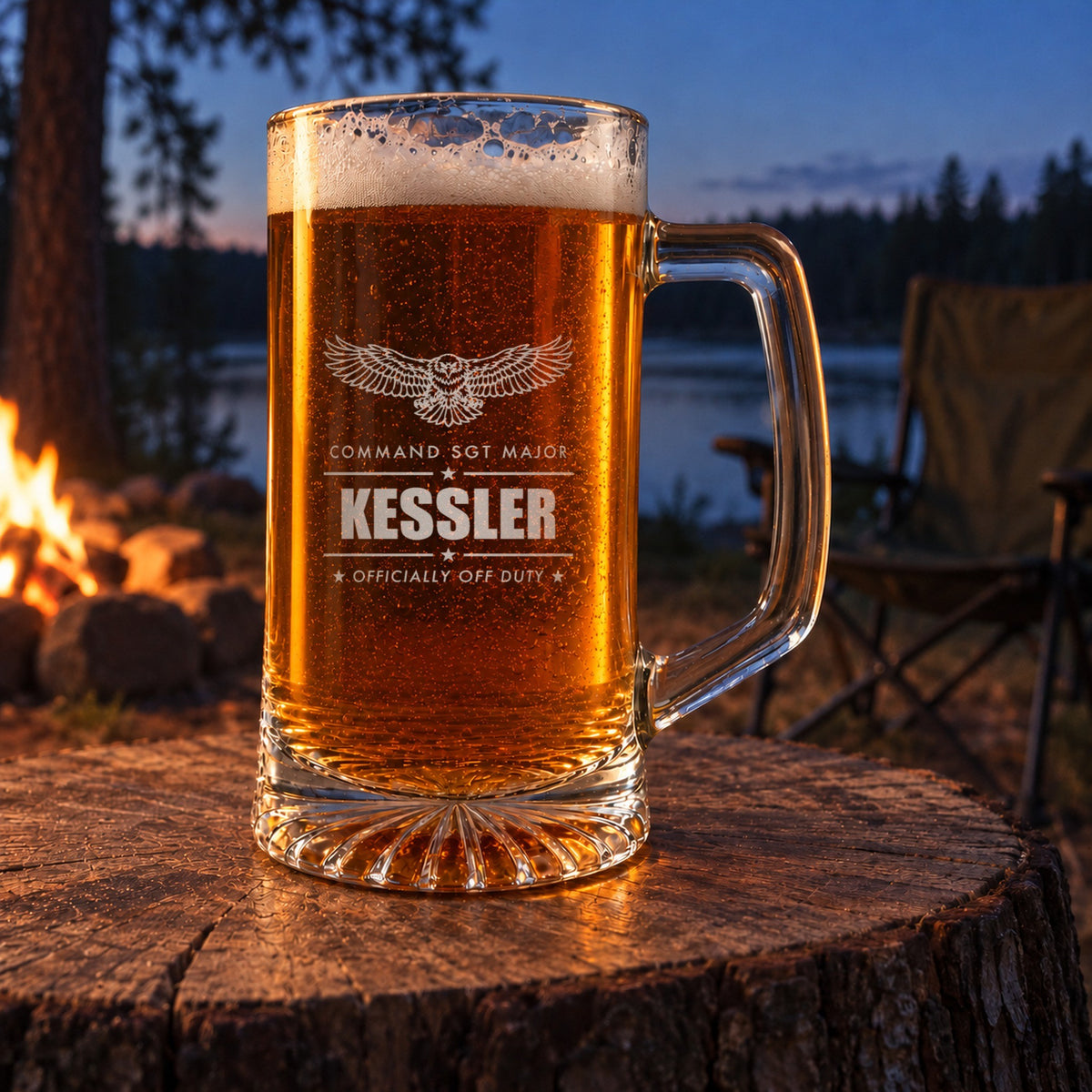 Engraved Army retirement beer stein on a stump by a lakeside campfire, personalized with an eagle, Command Sgt Major and Kessler