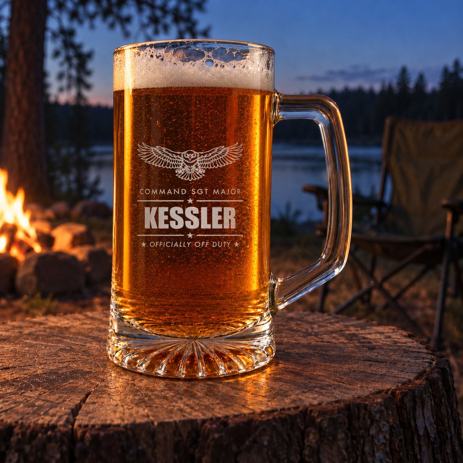 Engraved Army retirement beer stein on a stump by a lakeside campfire, personalized with an eagle, Command Sgt Major and Kessler