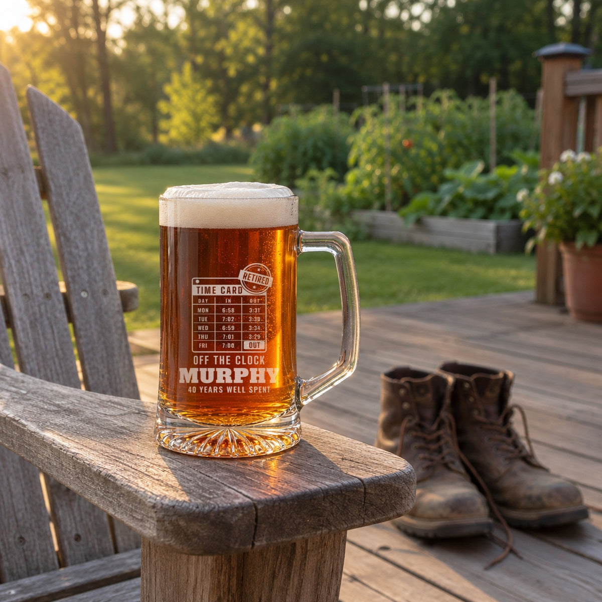 Personalized retirement beer mug on an Adirondack chair arm with his worn work boots set aside on the deck, engraved OFF THE CLOCK, MURPHY and 40 YEARS WELL SPENT