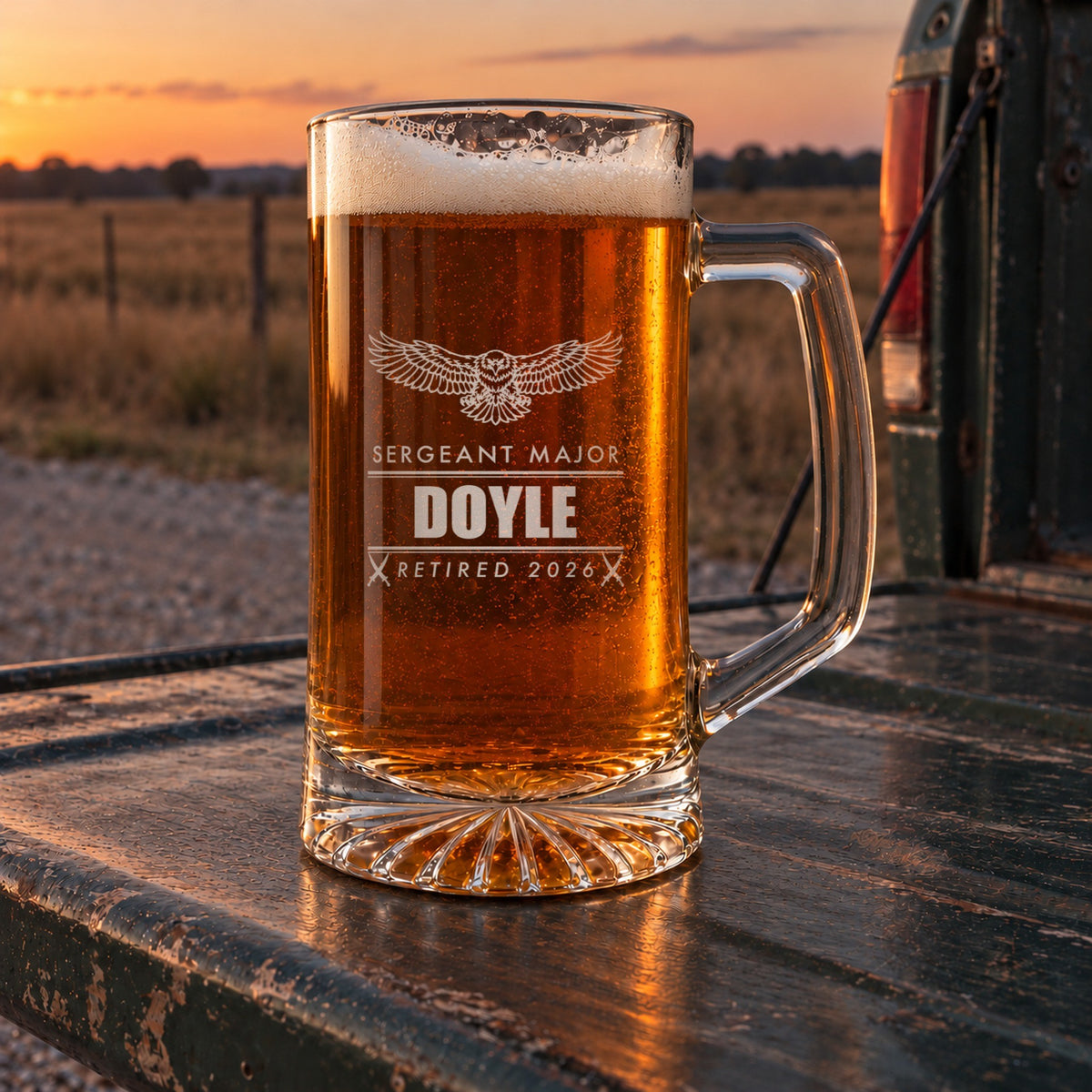 Engraved Marine retirement beer stein on a pickup truck tailgate at dusk, personalized with an eagle, Sergeant Major, Doyle and Retired 2026