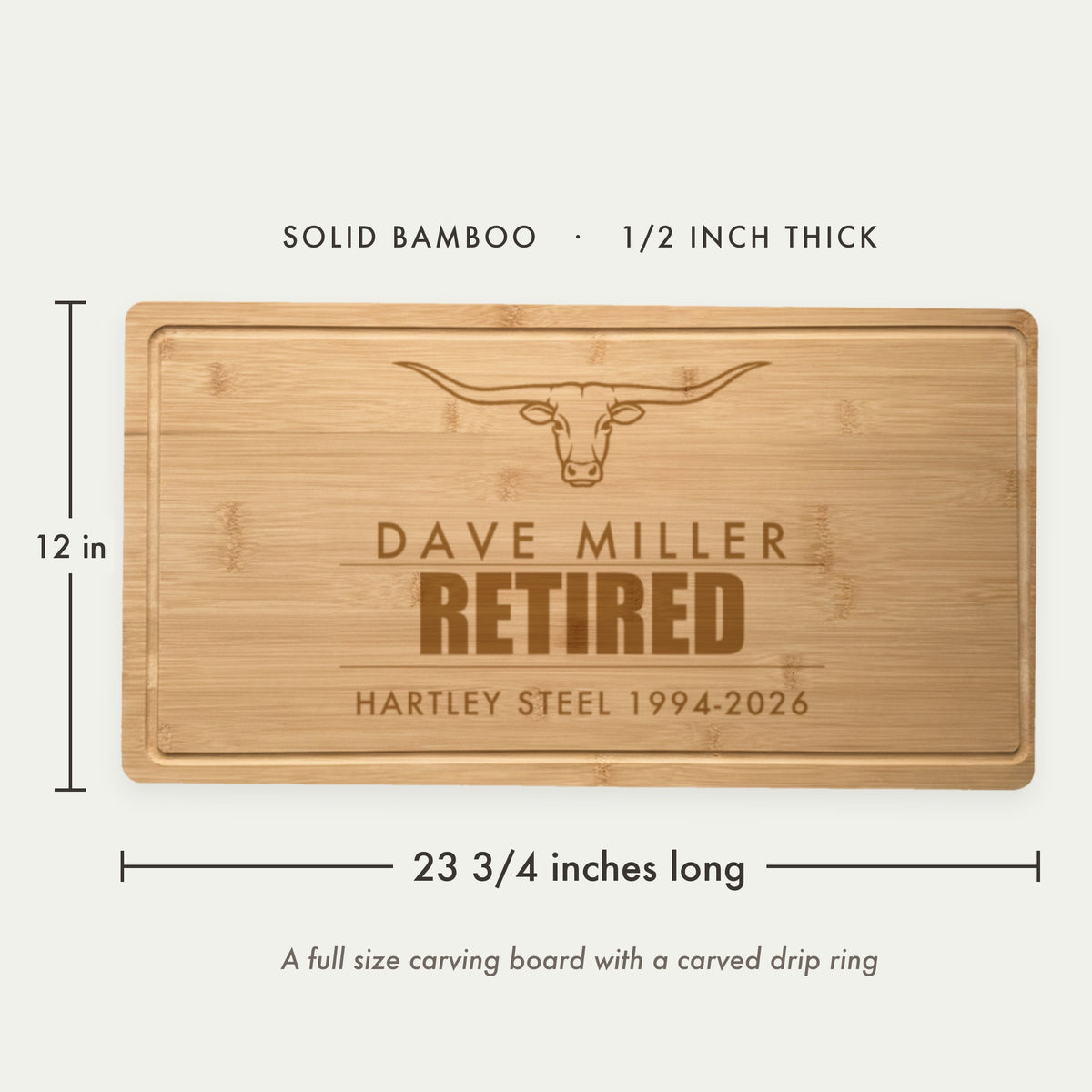Size guide for the personalized retirement cutting board in solid bamboo, 23 3/4 inches long by 12 inches wide and half an inch thick, with a drip ring