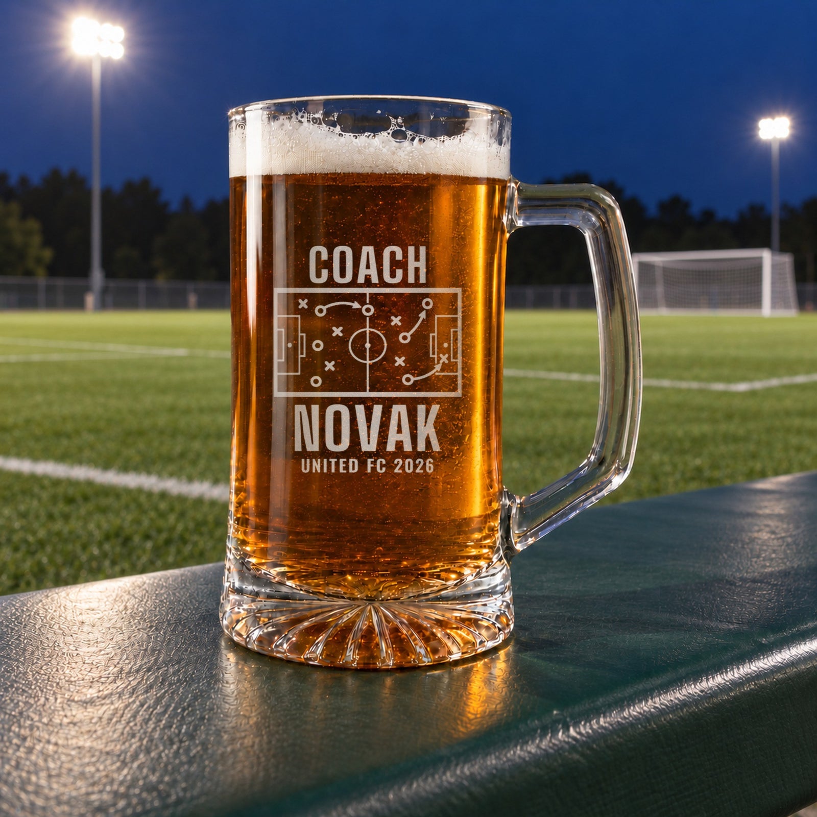 Personalized soccer coach tactics board beer stein in a real setting, engraved with a soccer pitch tactics board with X's, O's and passing arrows: Coach, Novak, United FC 2026