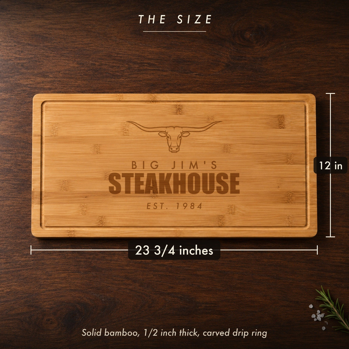 Size of the personalized steakhouse cutting board for dad, 23 3/4 inches long by 12 inches wide in half inch bamboo, engraved BIG JIM'S STEAKHOUSE
