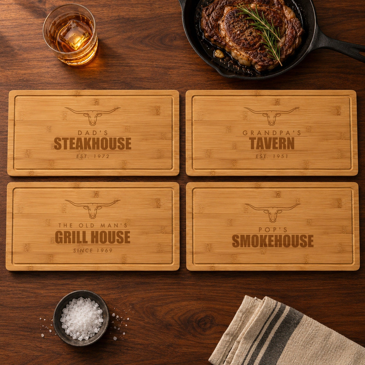 Four engraved steakhouse cutting boards for dad and grandpa: Dad's Steakhouse, Grandpa's Tavern, The Old Man's Grill House and Pop's Smokehouse