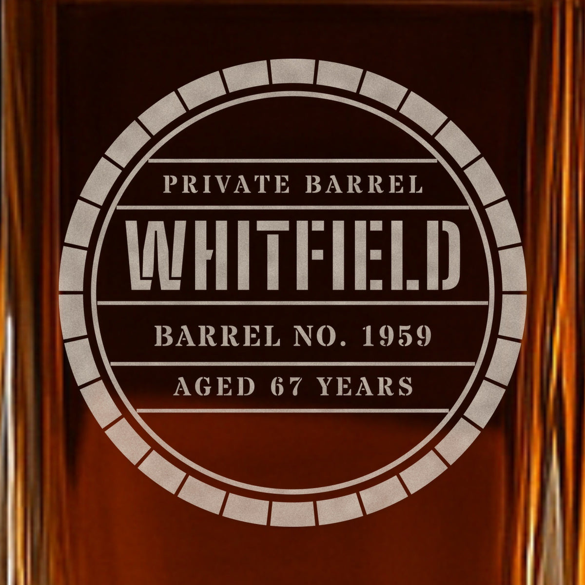 Close-up of the frosted barrel head engraving on a whiskey decanter: Private Barrel, Whitfield, Barrel No. 1959, Aged 67 Years, in stencil letters