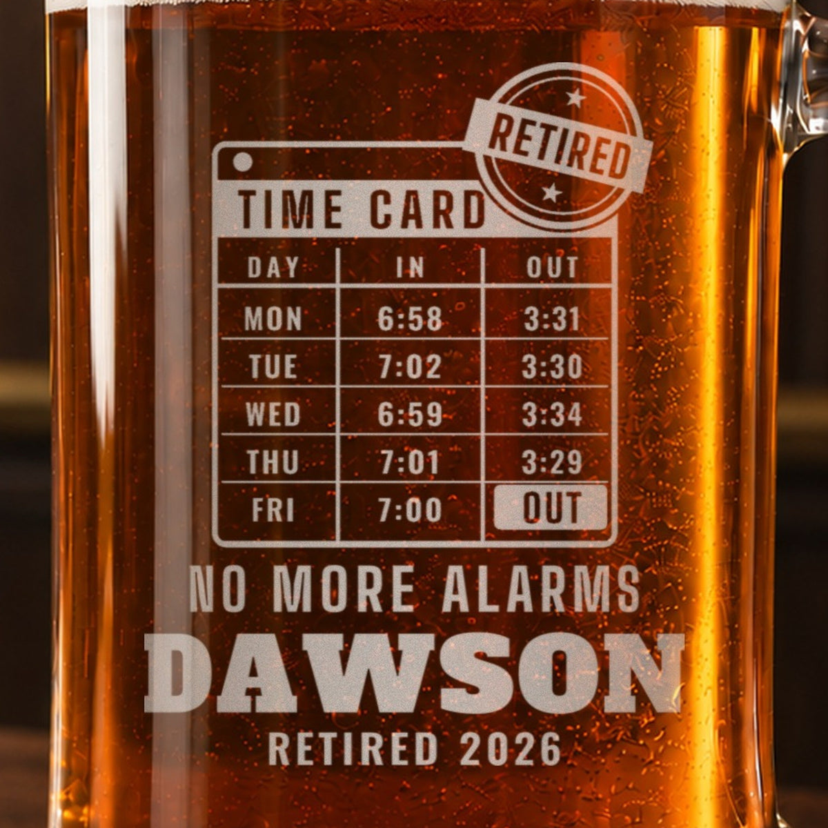 Close-up of the frosted time card engraving with Friday stamped OUT and a RETIRED stamp, reading NO MORE ALARMS, DAWSON and RETIRED 2026
