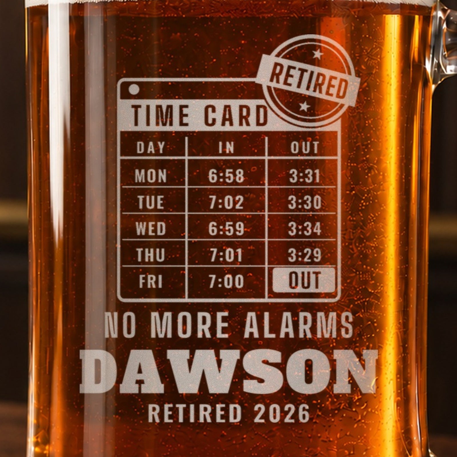 Close-up of the frosted time card engraving with Friday stamped OUT and a RETIRED stamp, reading NO MORE ALARMS, DAWSON and RETIRED 2026