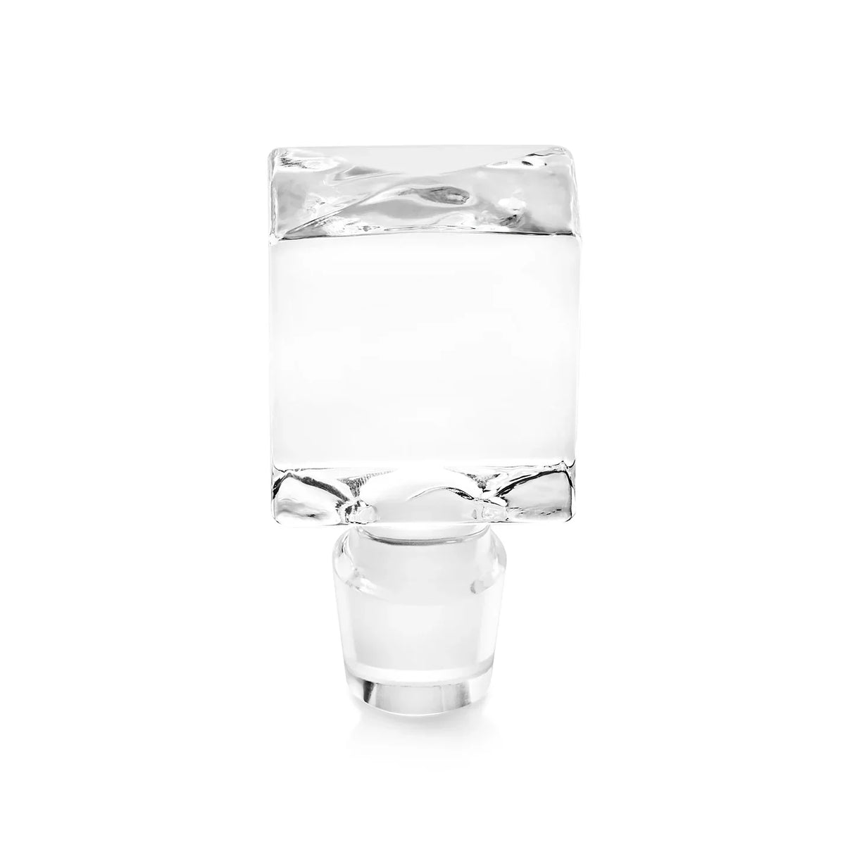 Crystal decanter filled with clear liquid and ice, shown with a matching empty rocks glass positioned below it against a white background.