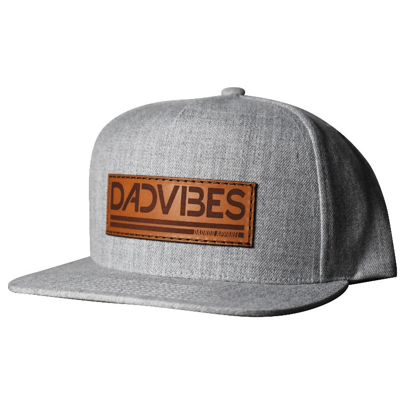 Heather grey Dad Vibes hat with brown leather patch and adjustable snapback.