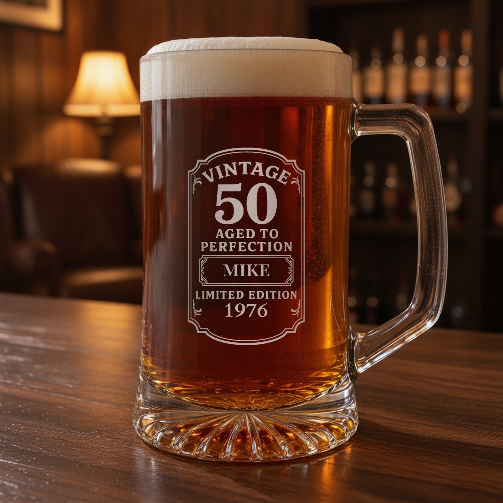 Vintage 50th birthday beer stein on a walnut home bar, frosted Vintage 50 Aged to Perfection label engraved with the name Mike and 1976
