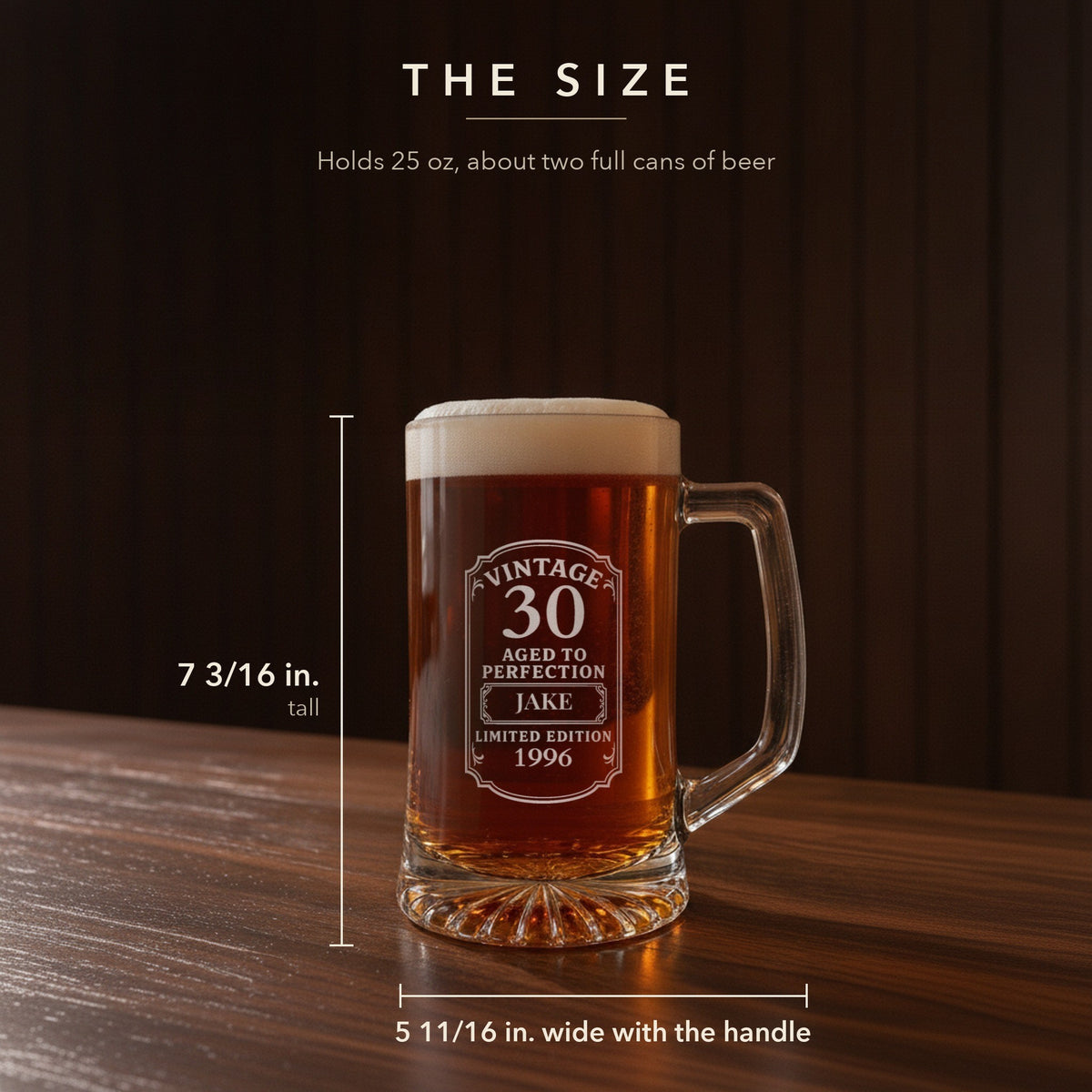 Size guide for the 25 oz personalized vintage birthday beer stein, 7 3/16 inches tall and 5 11/16 inches wide with the handle, for a 30th