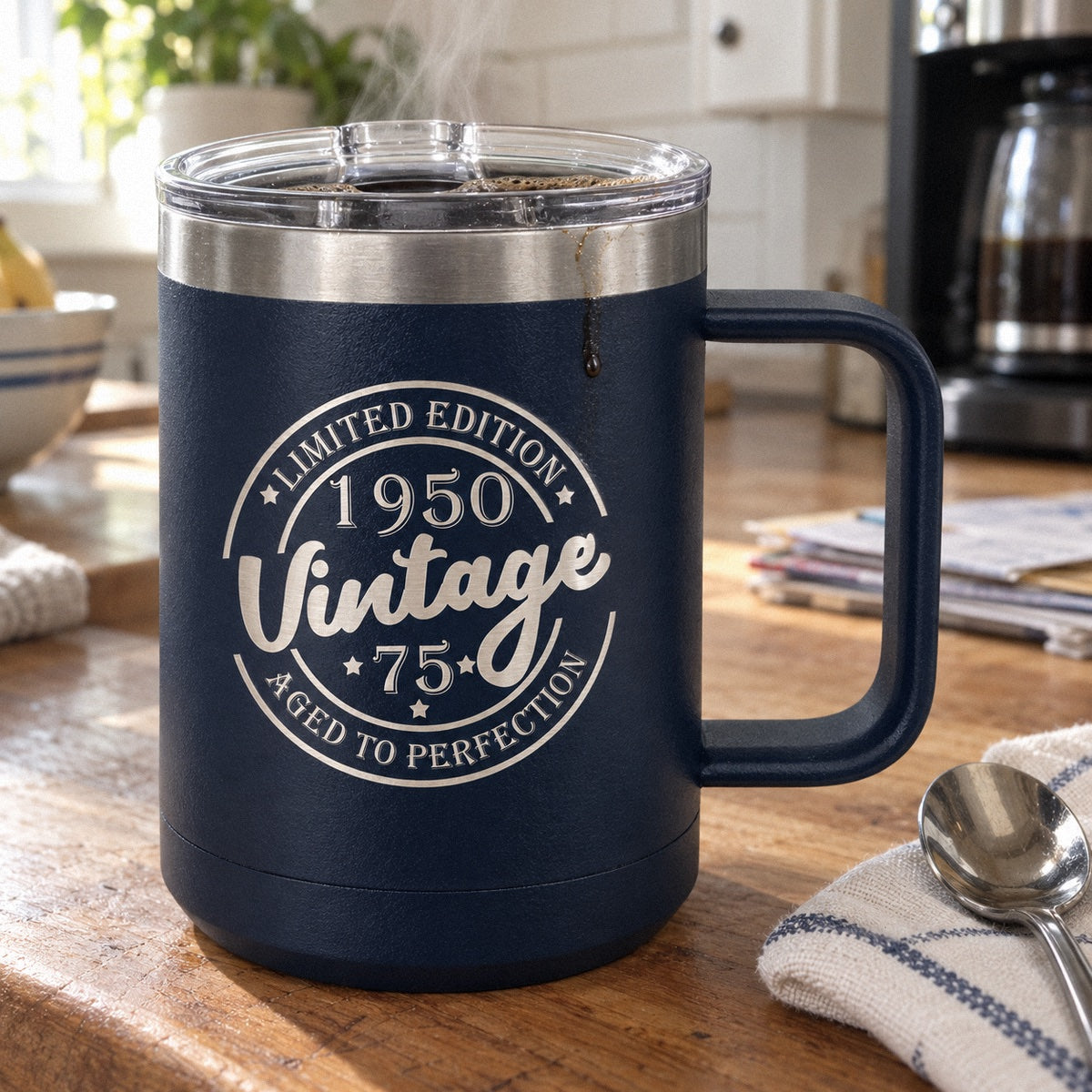 Vintage birthday coffee tumbler in navy engraved Limited Edition 1950 Vintage 75 Aged to Perfection, a 75th birthday mug of coffee
